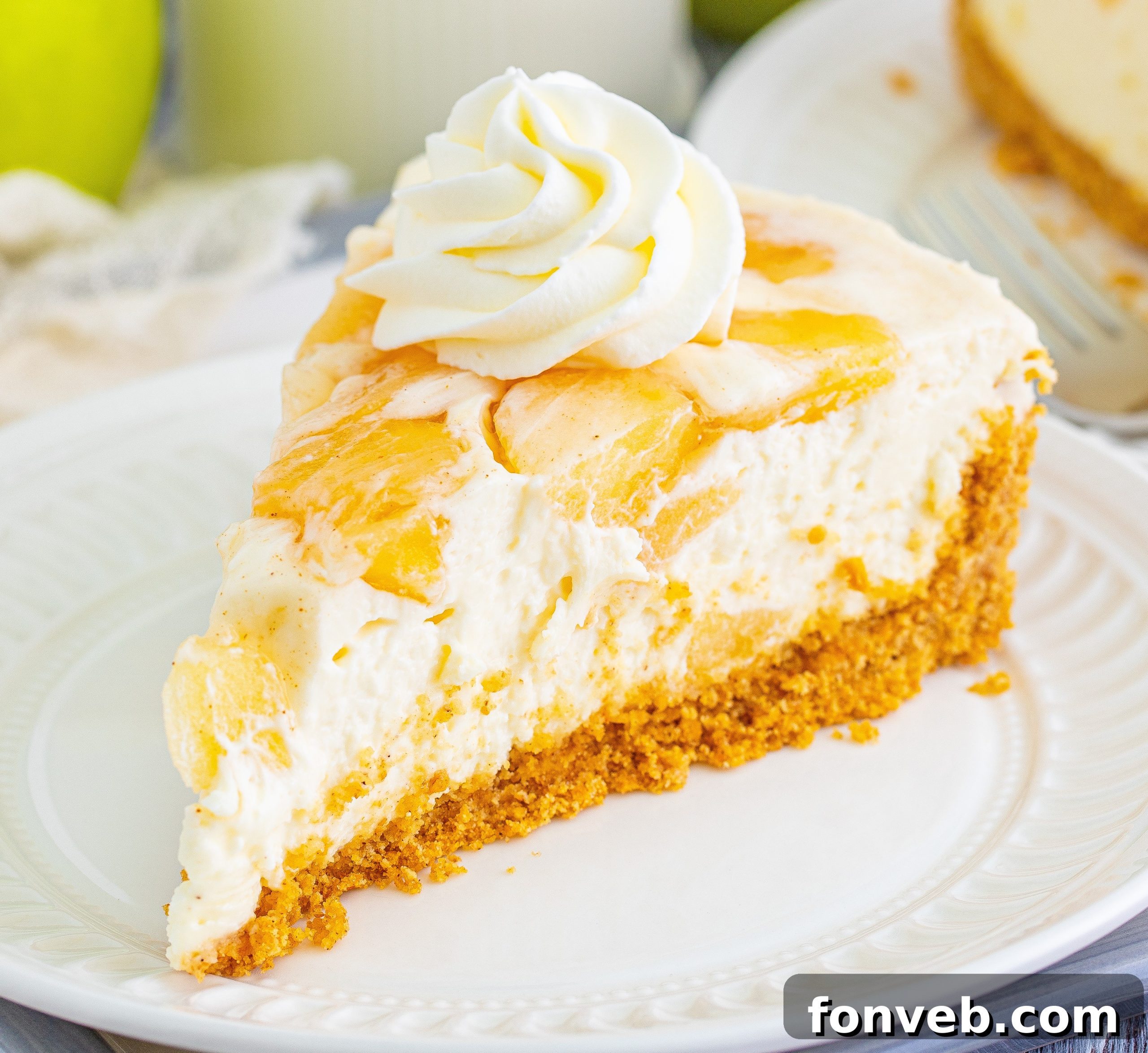 Chilled Apple Pie Cheesecake 12 A portion of apple pie filling being folded into the cheesecake mixture.