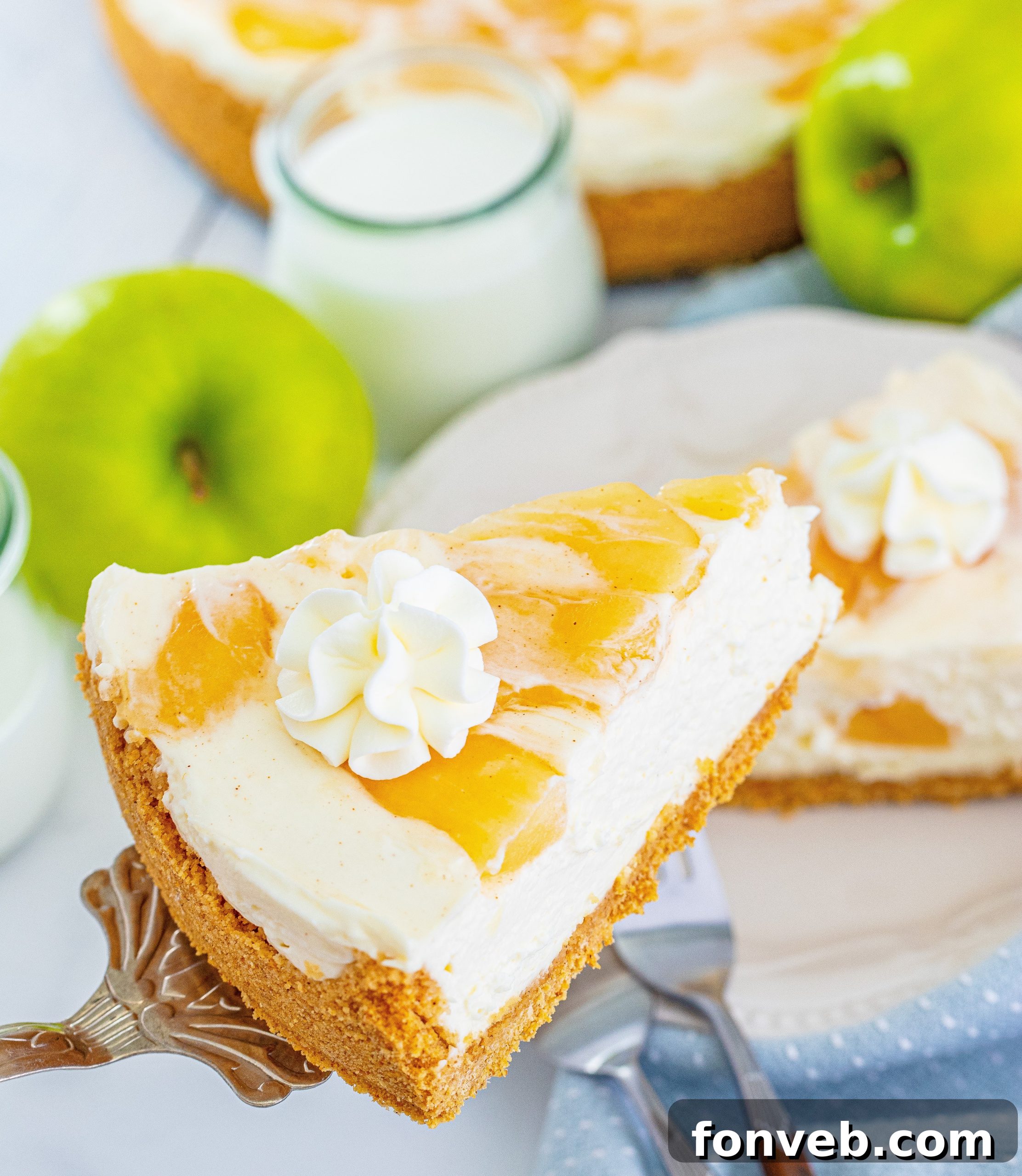 Chilled Apple Pie Cheesecake 15 A close-up of a slice of the cheesecake, showing its smooth texture.
