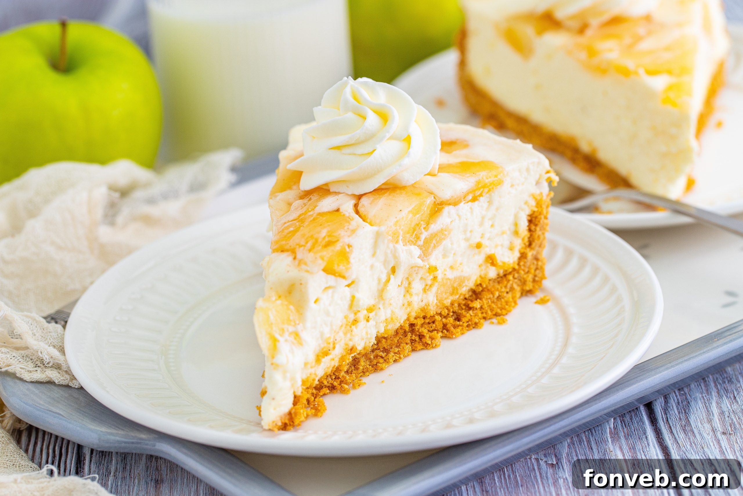 Chilled Apple Pie Cheesecake 7 No Bake Apple Cheesecake garnished with extra cinnamon.