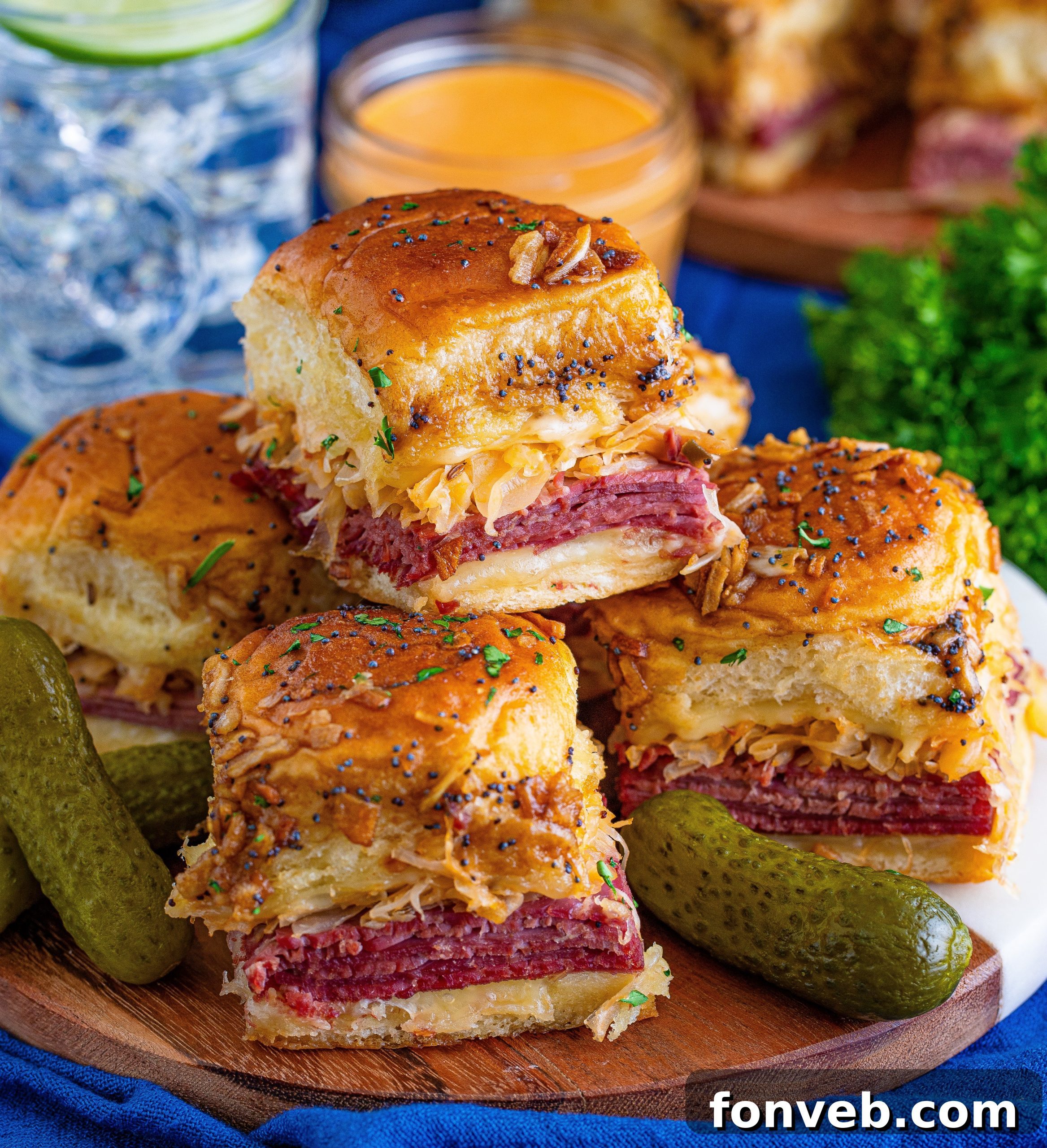 Close-up of baked Reuben Sliders, golden brown and cheesy, ready to be served.