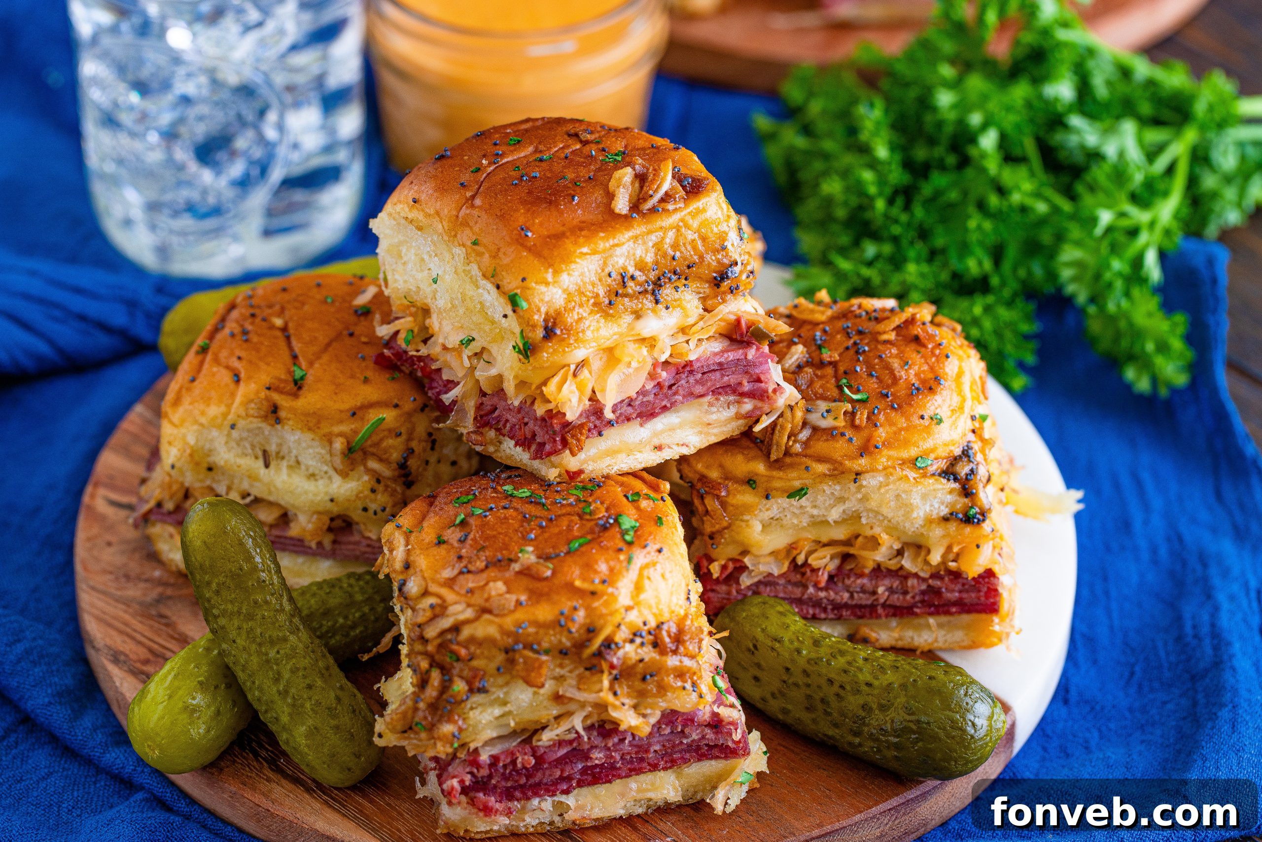 Individual Reuben Slider cut in half to show the juicy corned beef and melted Swiss.