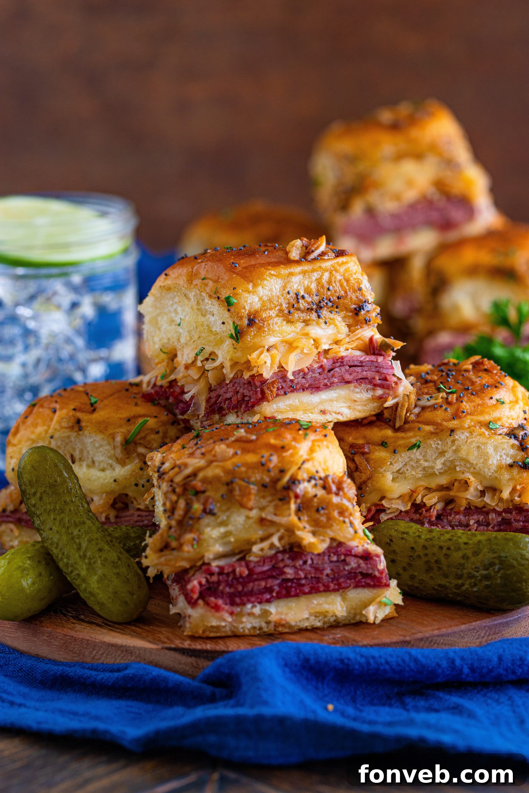 Individual Reuben Slider showing the layers of corned beef, cheese, and sauerkraut.