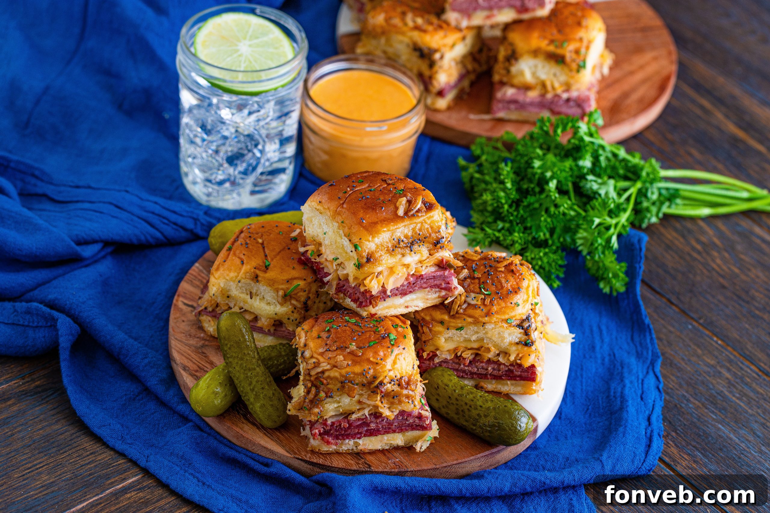 Close-up of the slider topping with poppy seeds and melted butter before baking.