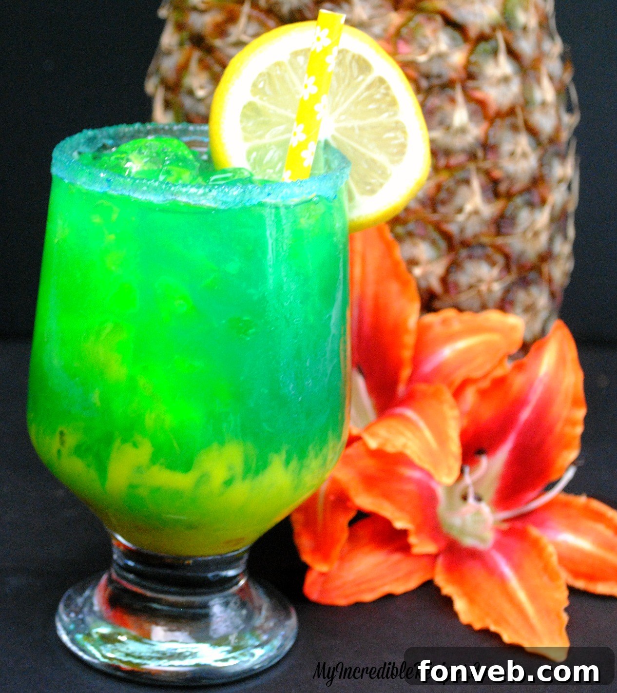 A chilled Lava Cocktail with a sugared rim and lemon garnish, ready to be enjoyed by the pool.