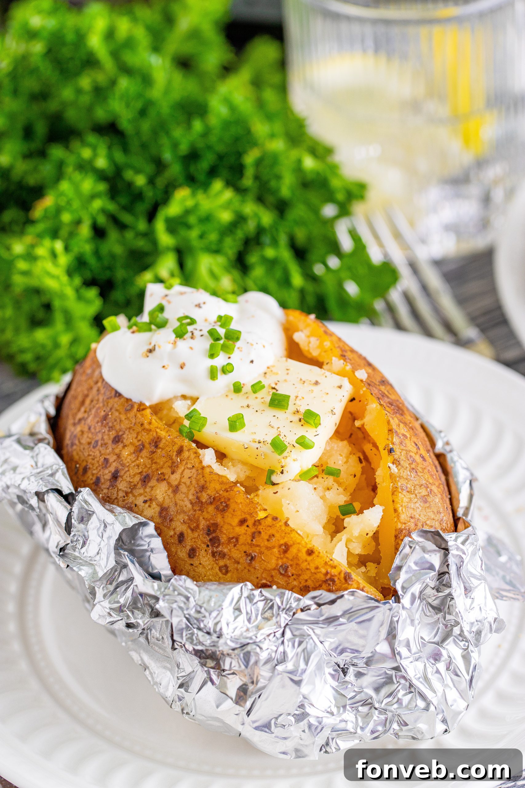 A vibrant close-up of a baked potato loaded with various delicious toppings including cheese, bacon, and chives