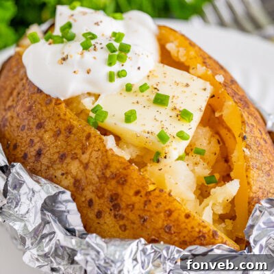 A delicious Slow Cooker Sour Cream & Chive Baked Potato recipe image