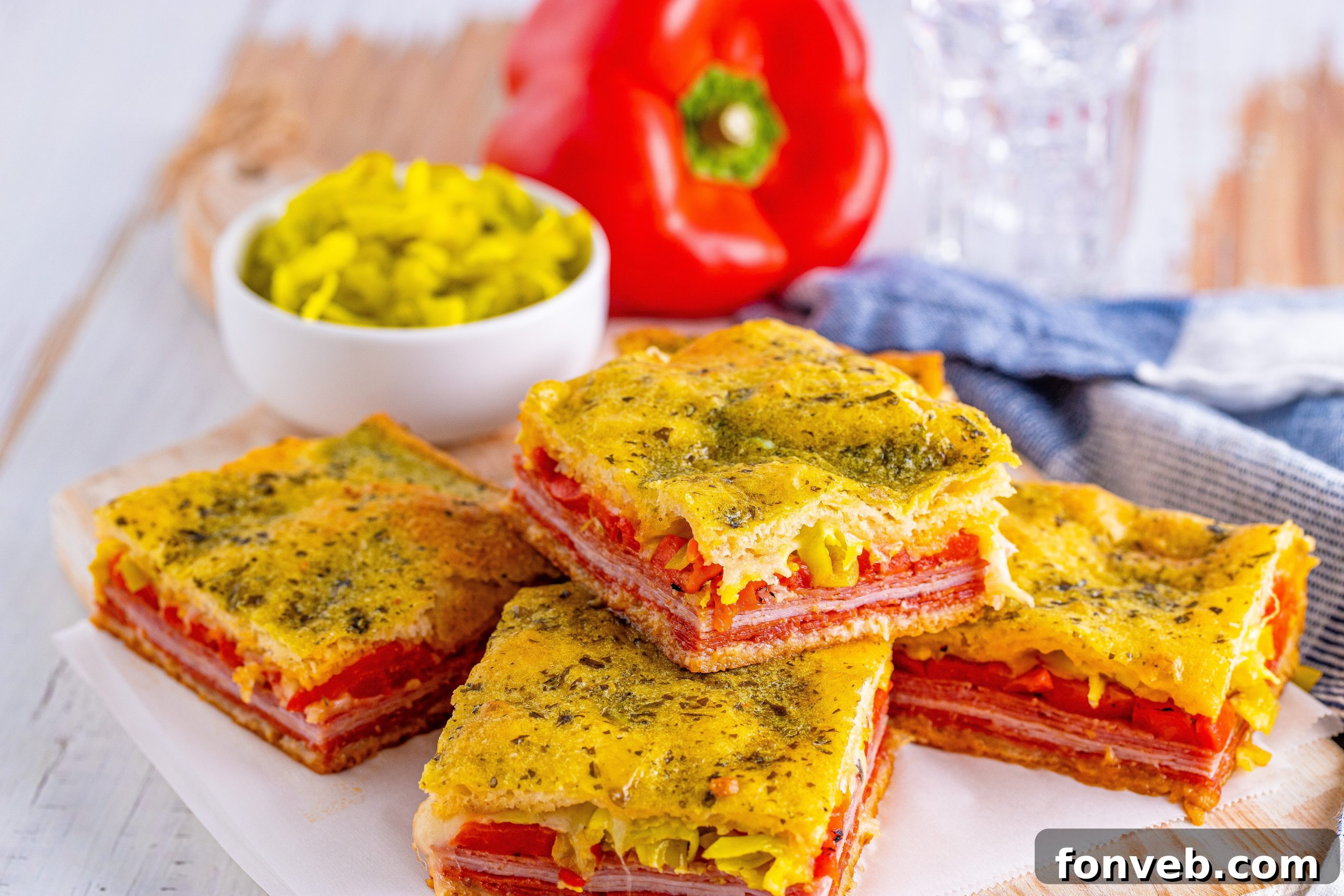 Various deli meats like ham, pepperoni, and salami, and provolone cheese slices.