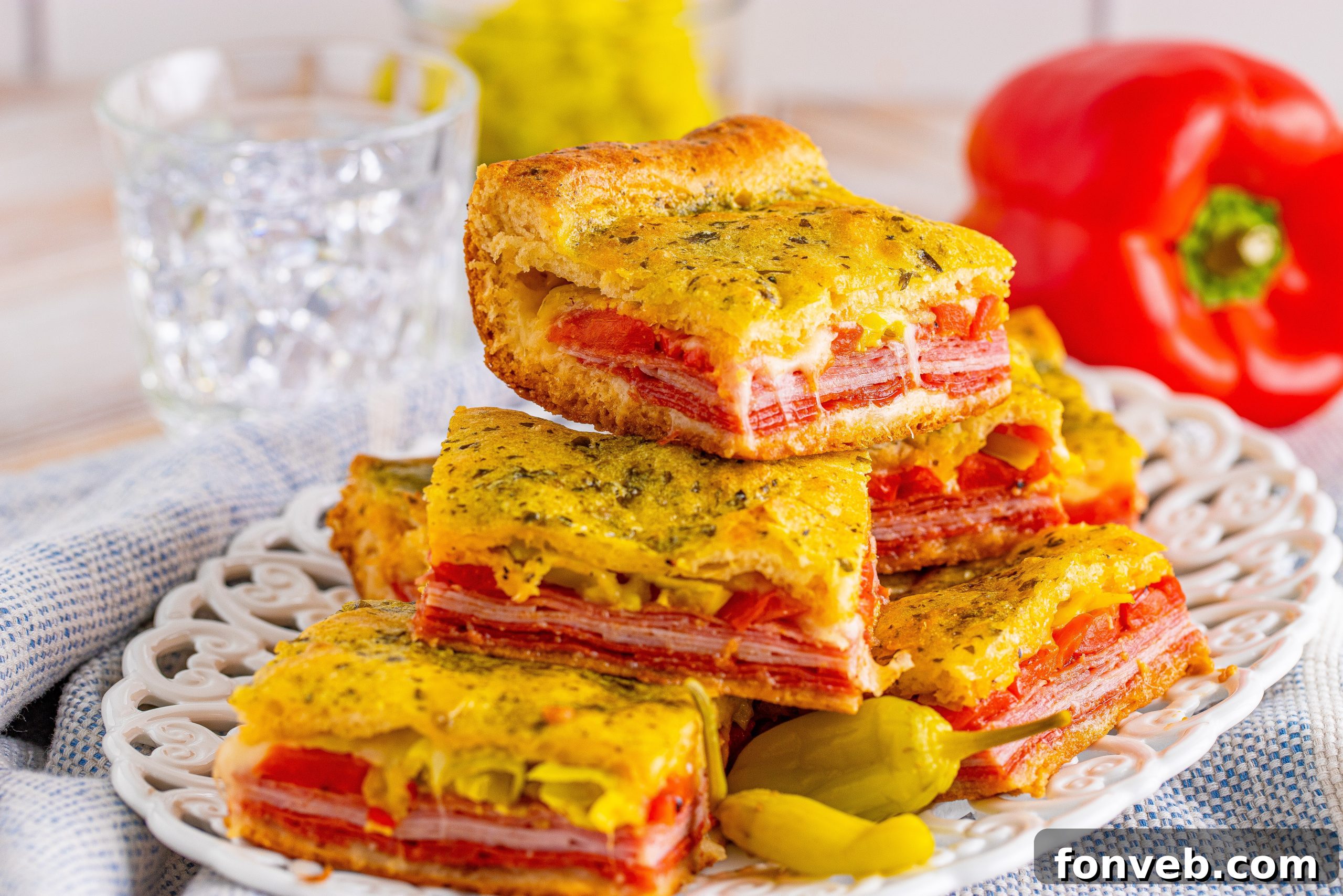 A cross-section of an Italian Antipasto Square, showing the rich filling.