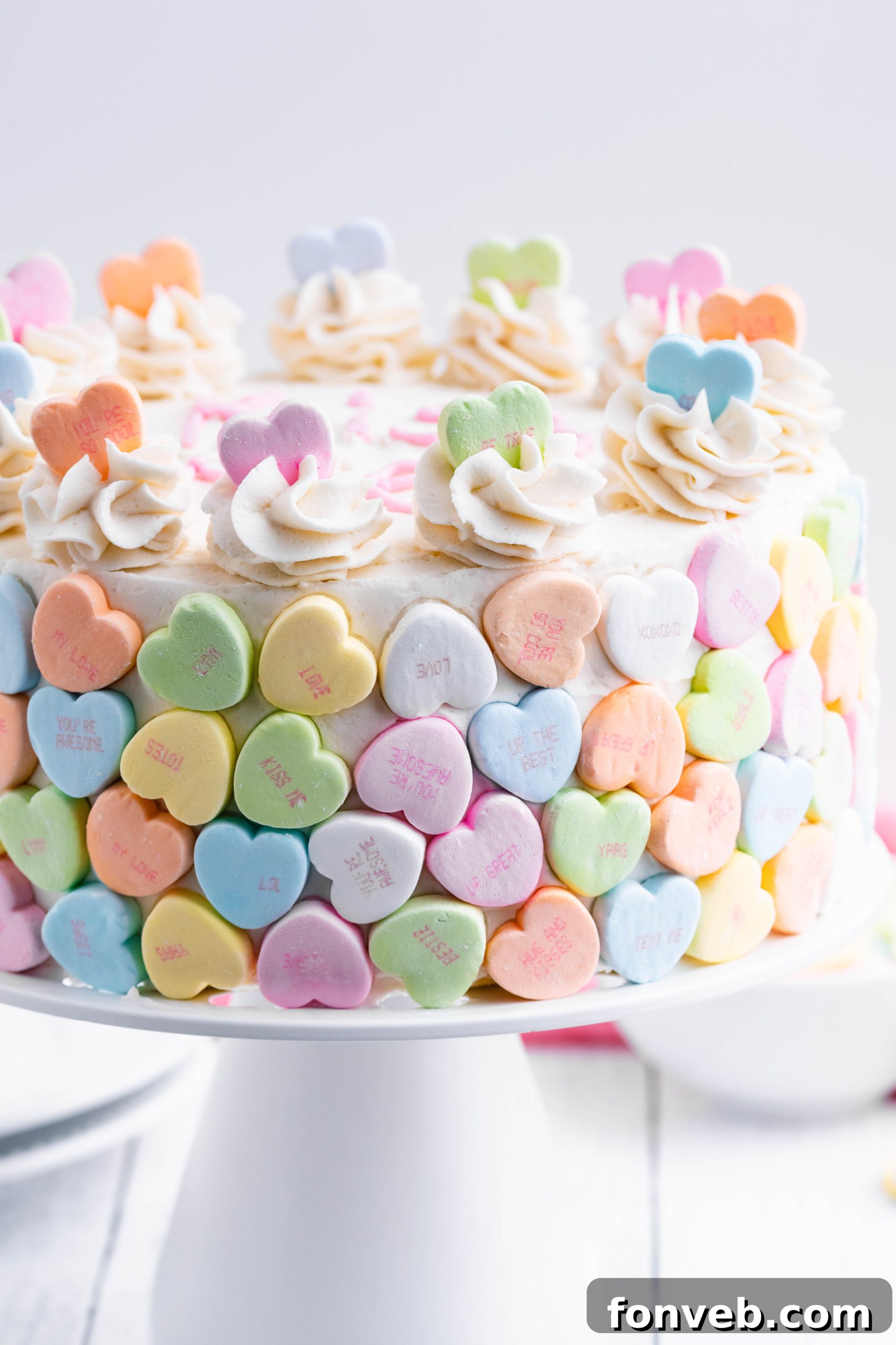 Top view of a freshly baked Conversation Hearts Cake