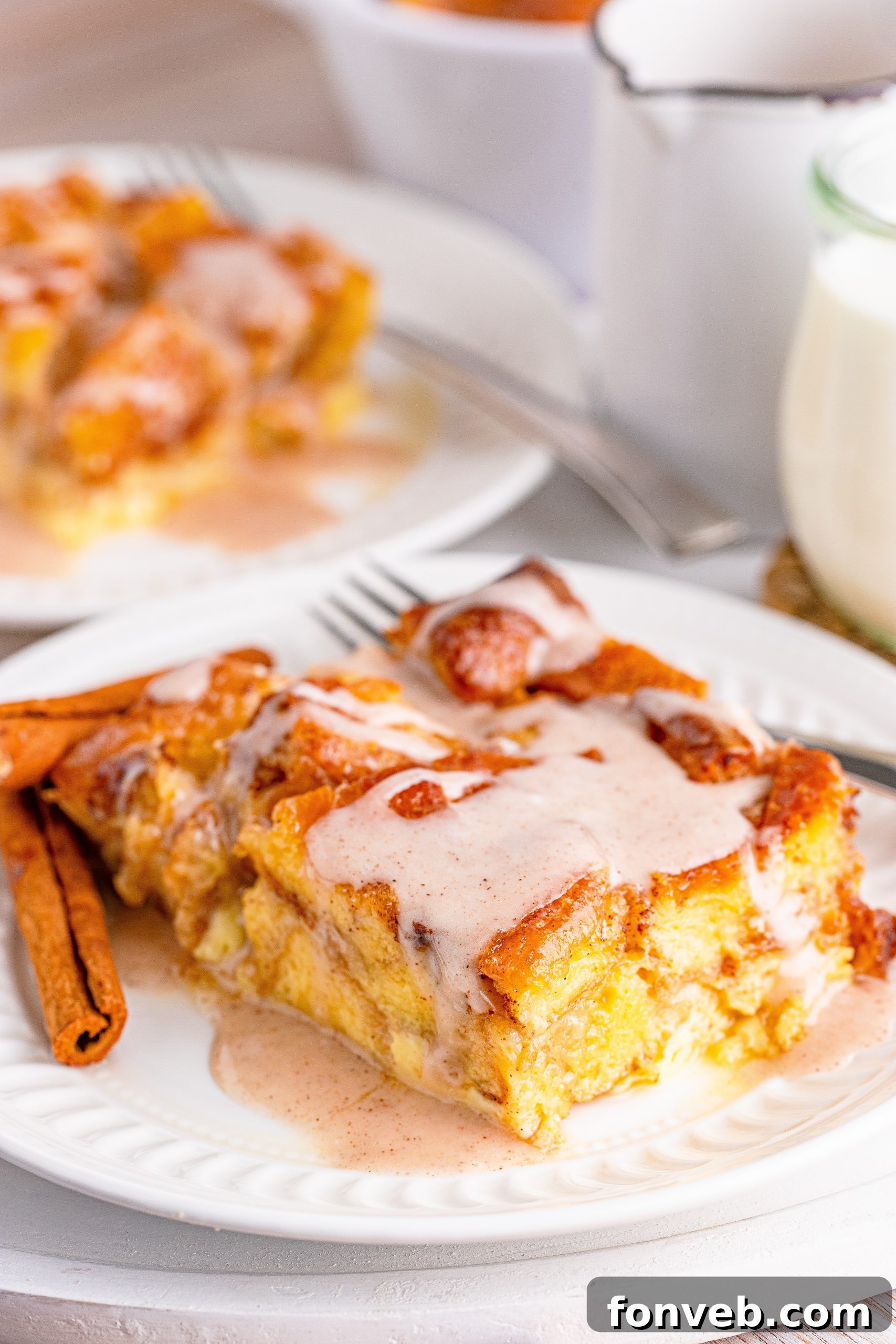 Glazed Honeybun Bread Pudding on a plate with fork