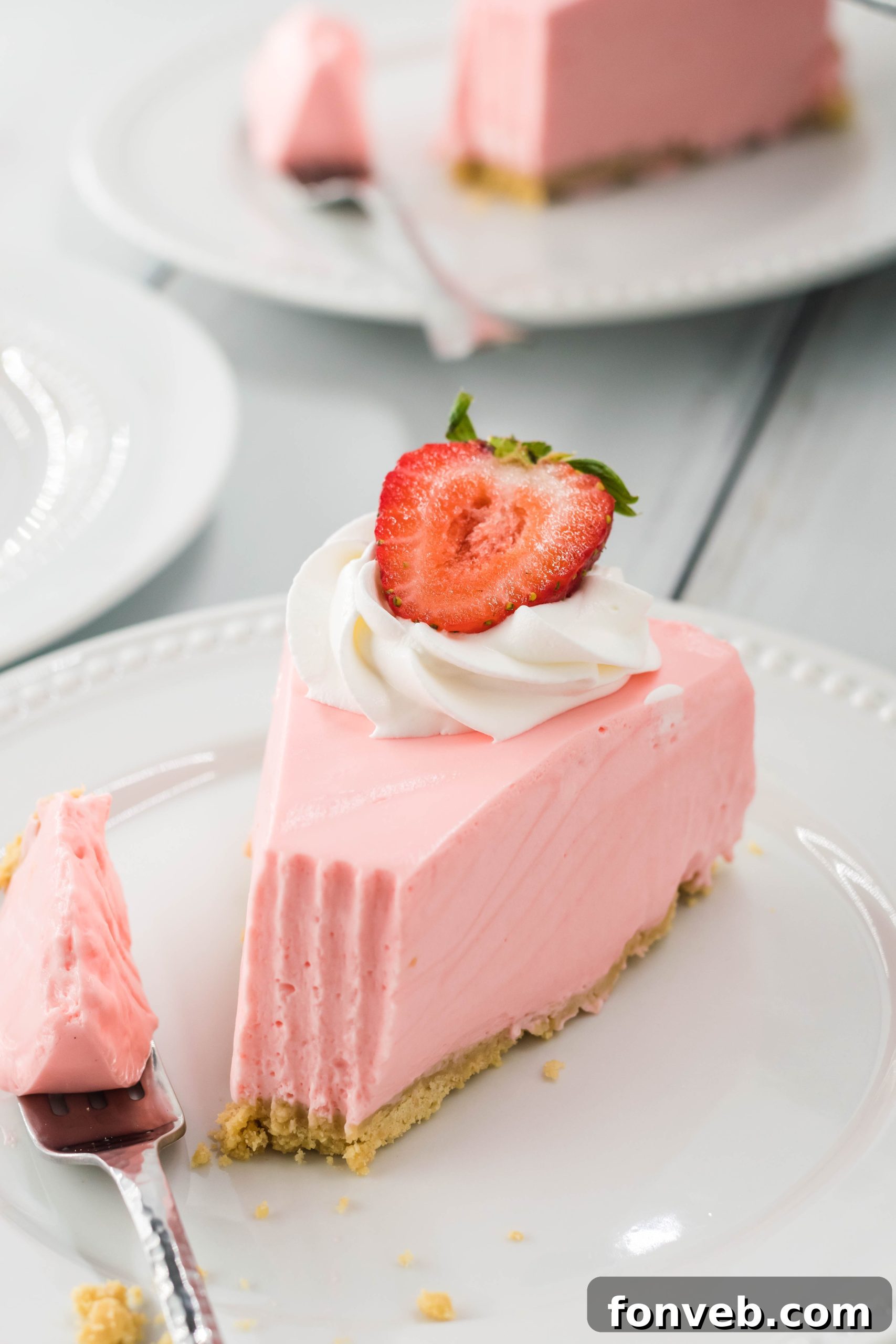 Luscious No-Bake Strawberry Cheesecake 7 Various ingredients for No Bake Strawberry Cheesecake laid out, including cream cheese, Jell-O, and whipping cream.