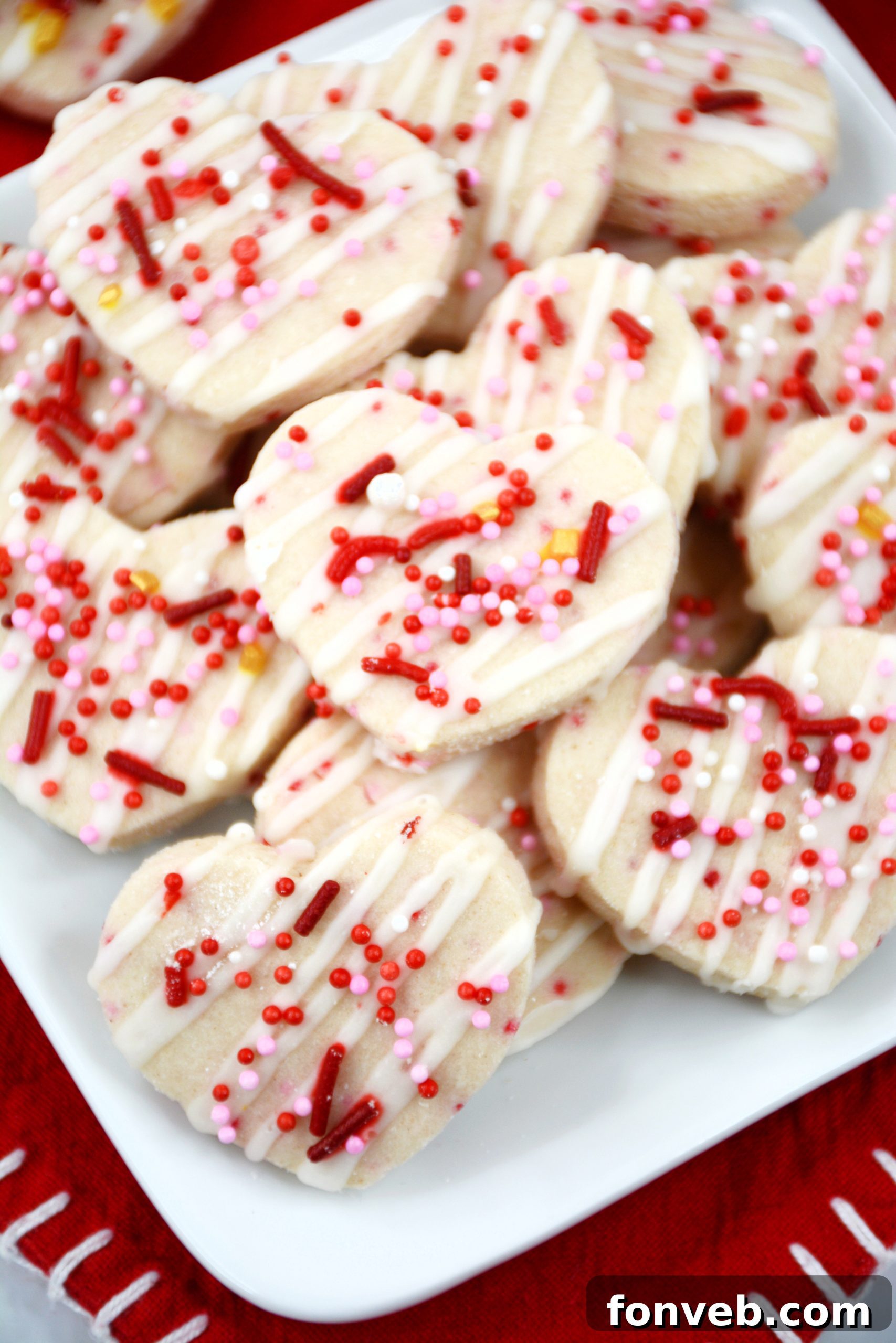 Freshly baked Valentine's Day Shortbread Cookie Bites cooling on a wire rack.