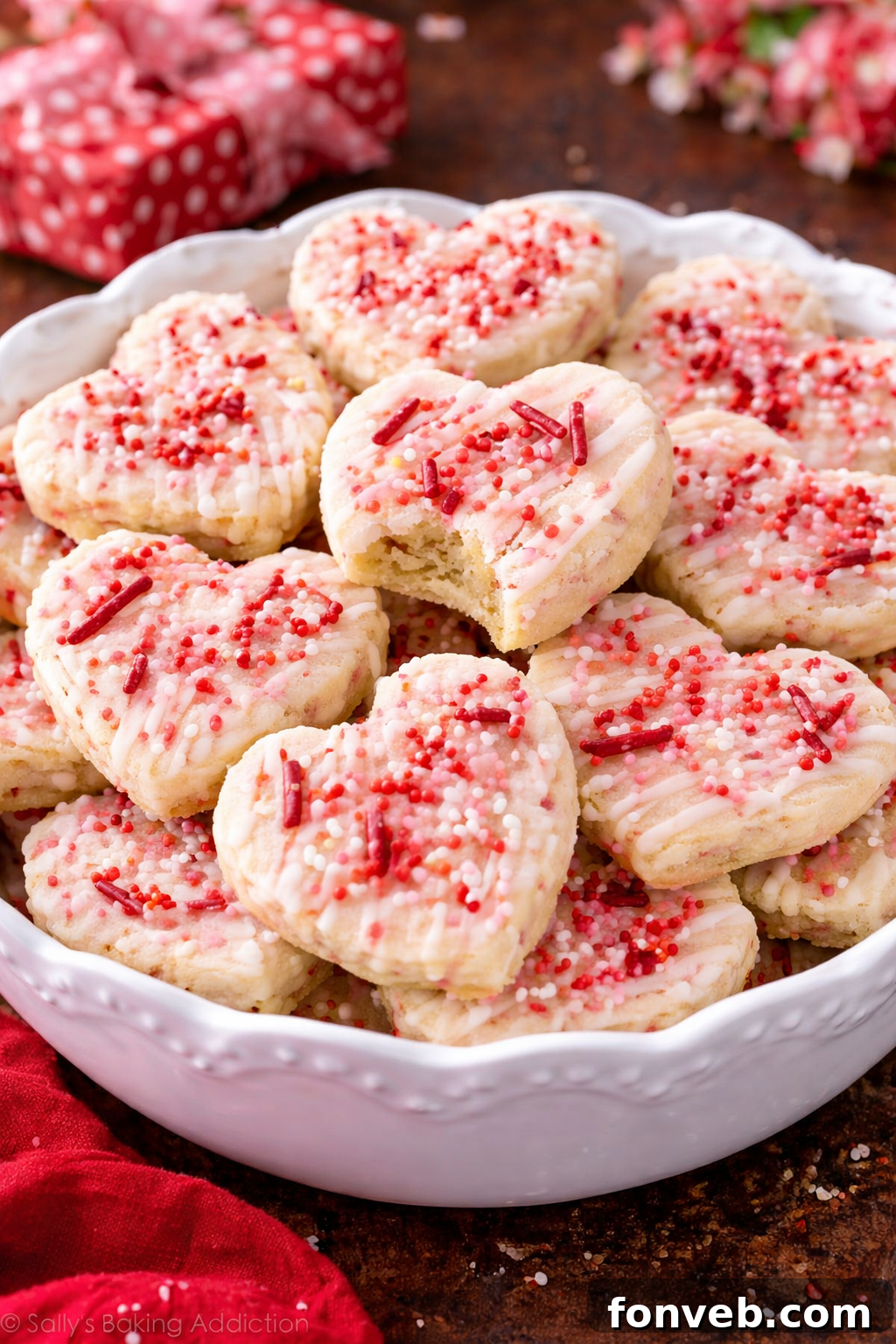 A large, decorative bowl overflowing with Valentine’s Day Shortbread Cookie Bites, inviting guests to indulge.