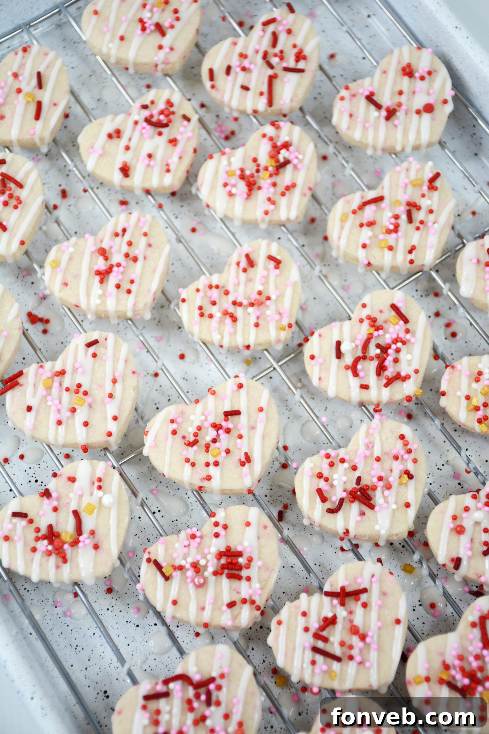 Ingredients for Valentine's Day Shortbread Cookie Bites neatly laid out, including sprinkles and extracts.