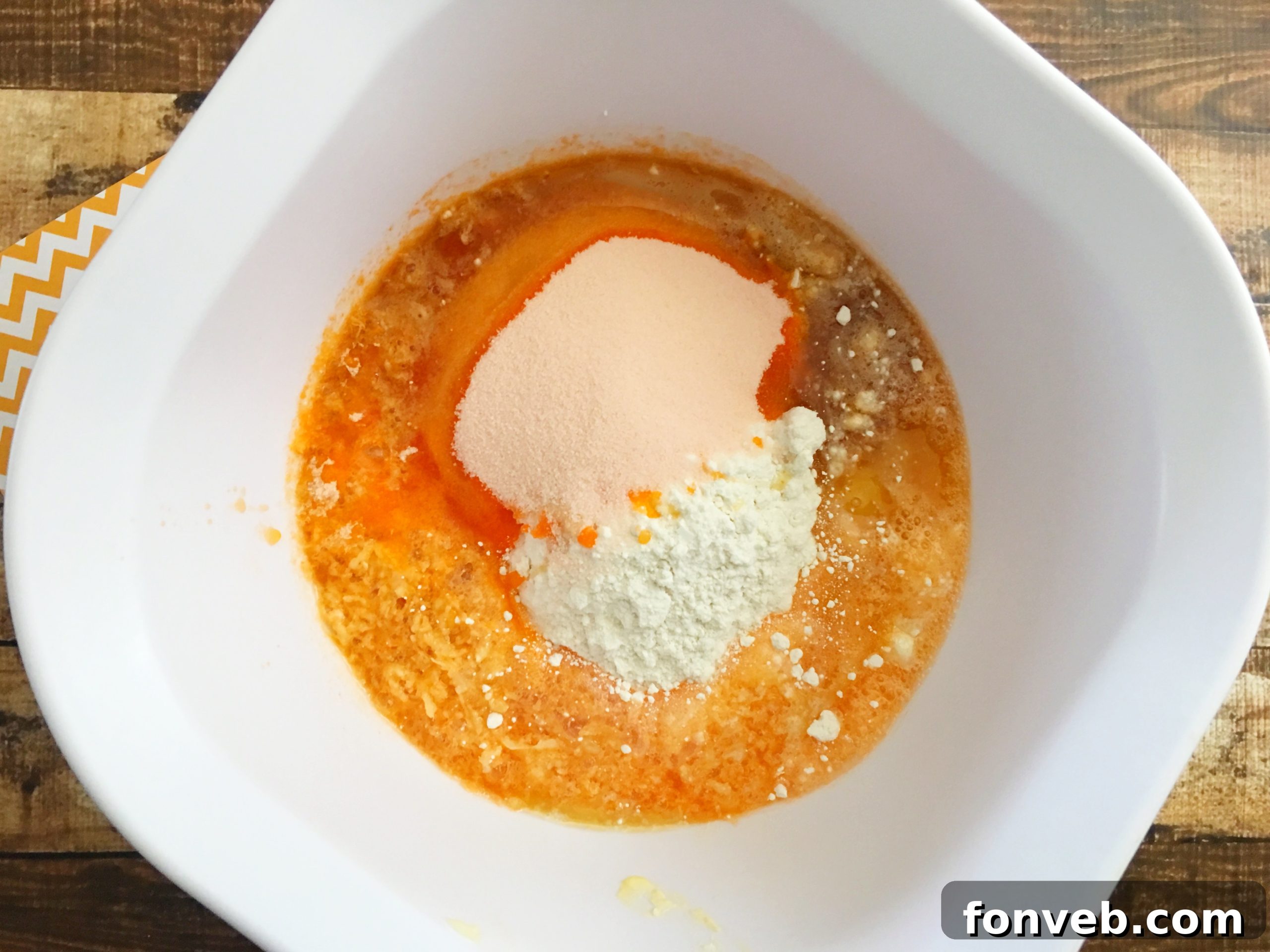 Ingredients for making Orange Creamsicle Cupcakes laid out on a table.