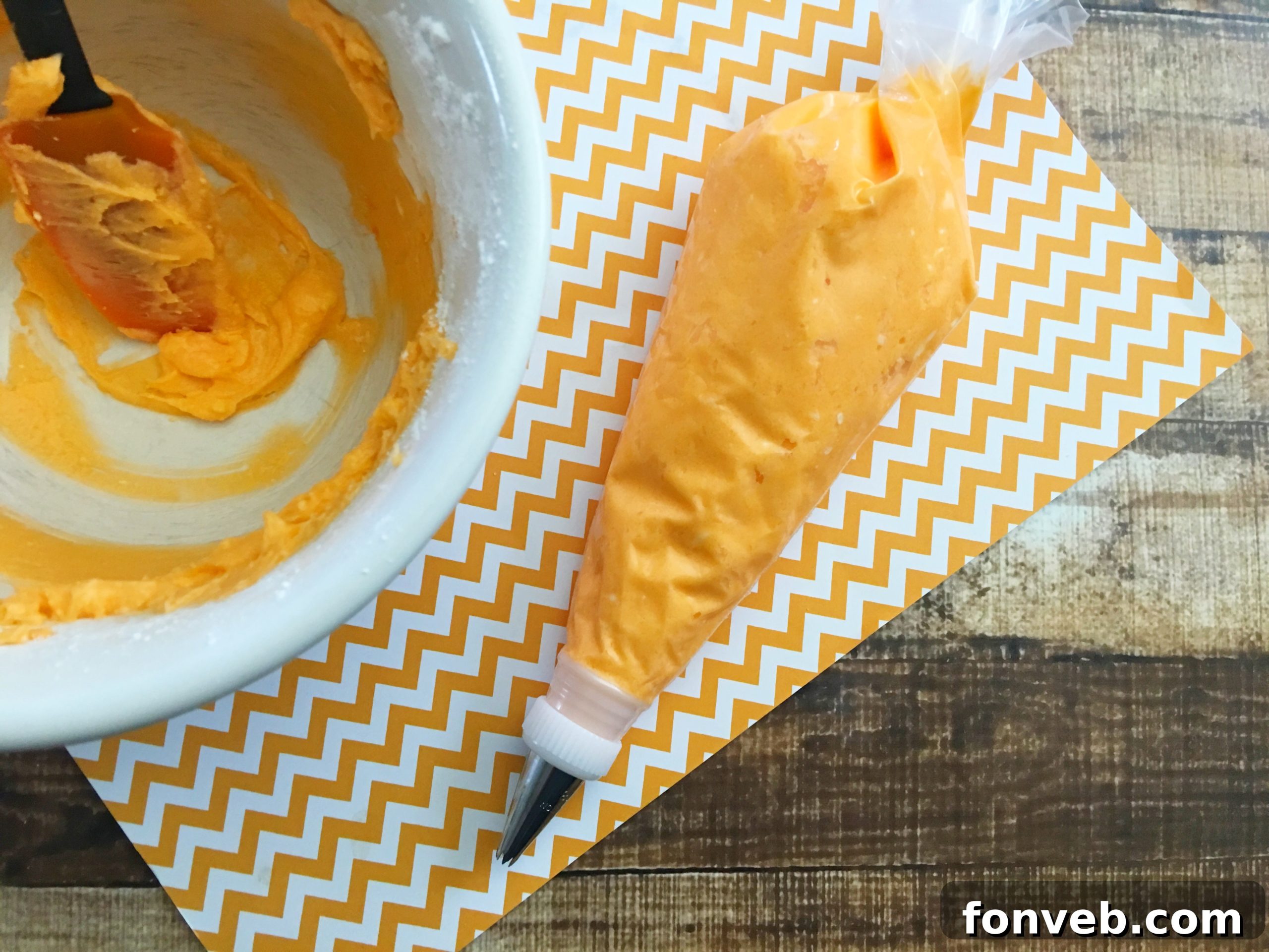 Close-up of baked Orange Creamsicle Cupcakes cooling in a pan.