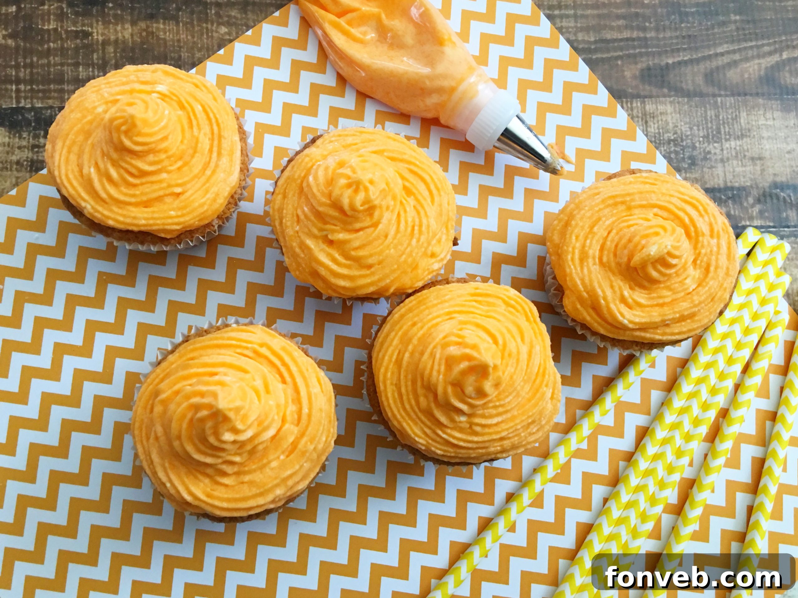 A batch of Orange Creamsicle Cupcakes, ready for enjoyment.