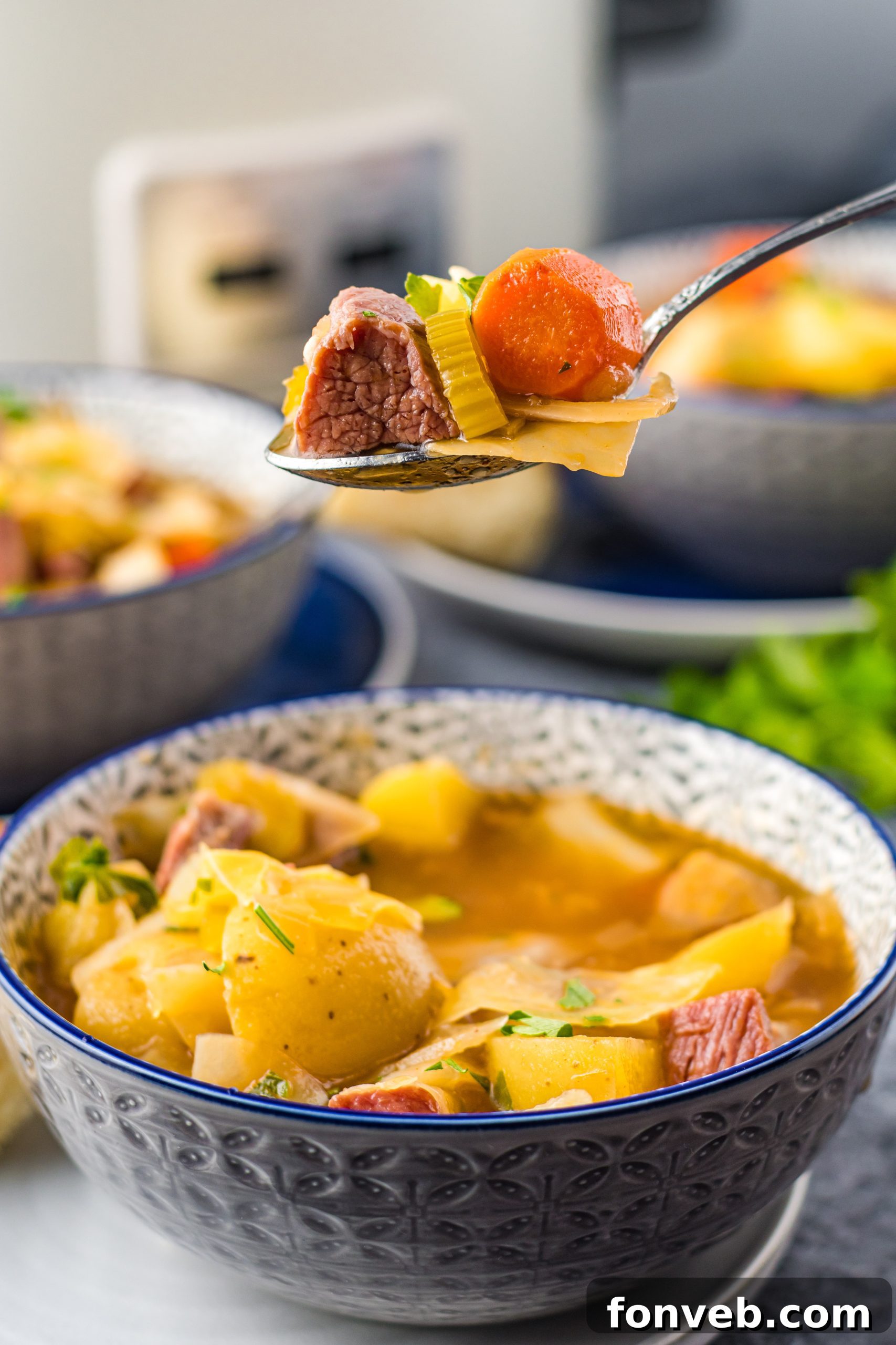 A close-up of a serving of Slow Cooker Corned Beef and Cabbage Soup