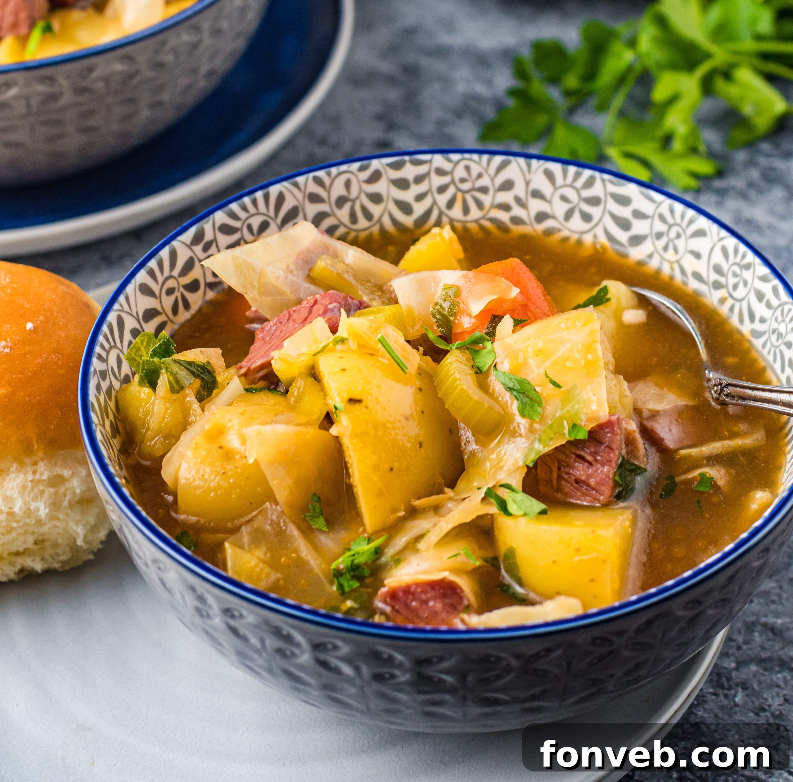 Slow Cooker Corned Beef and Cabbage Soup in a rustic bowl