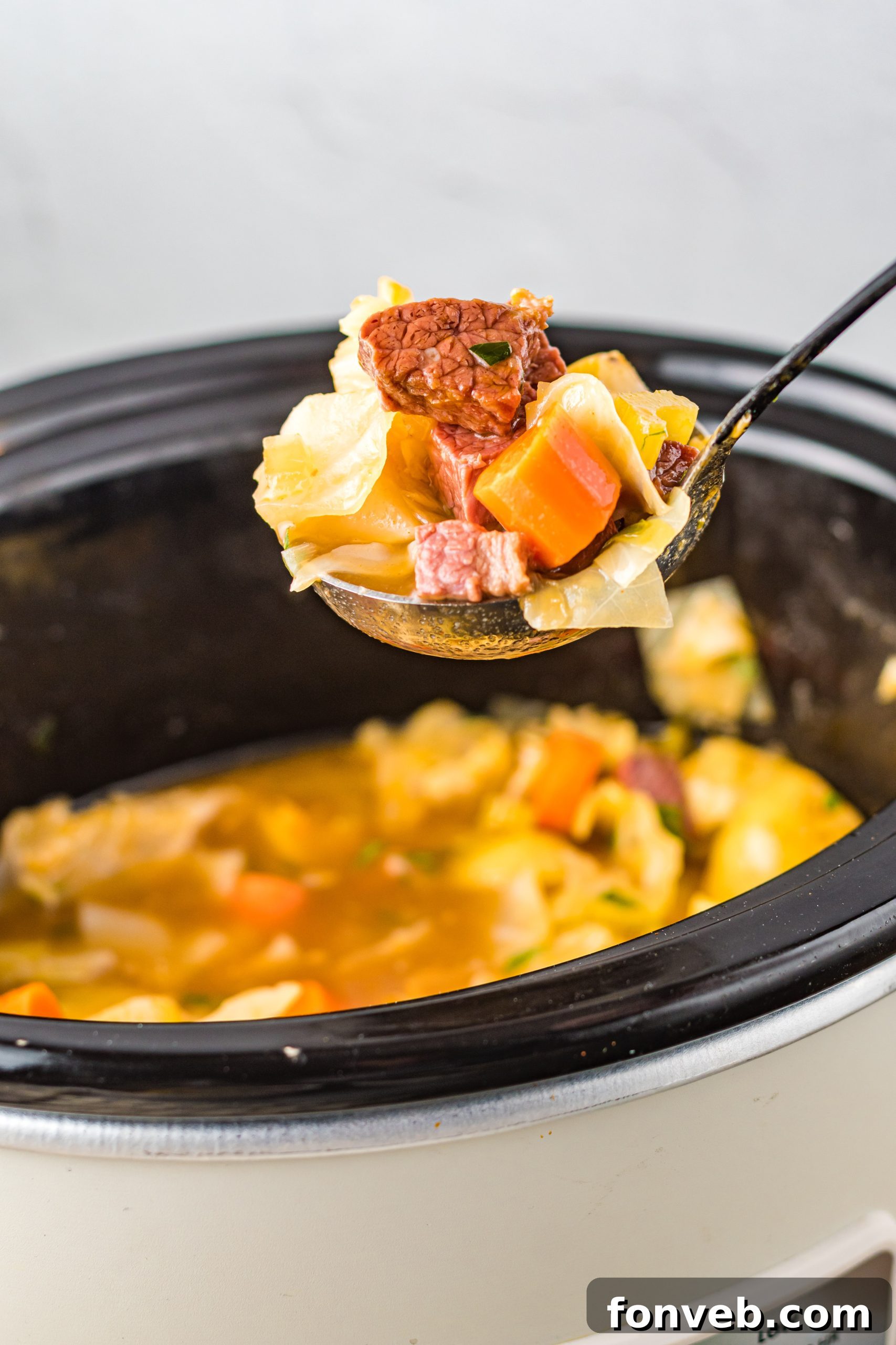 Slow Cooker Corned Beef and Cabbage Soup cooking in a crockpot