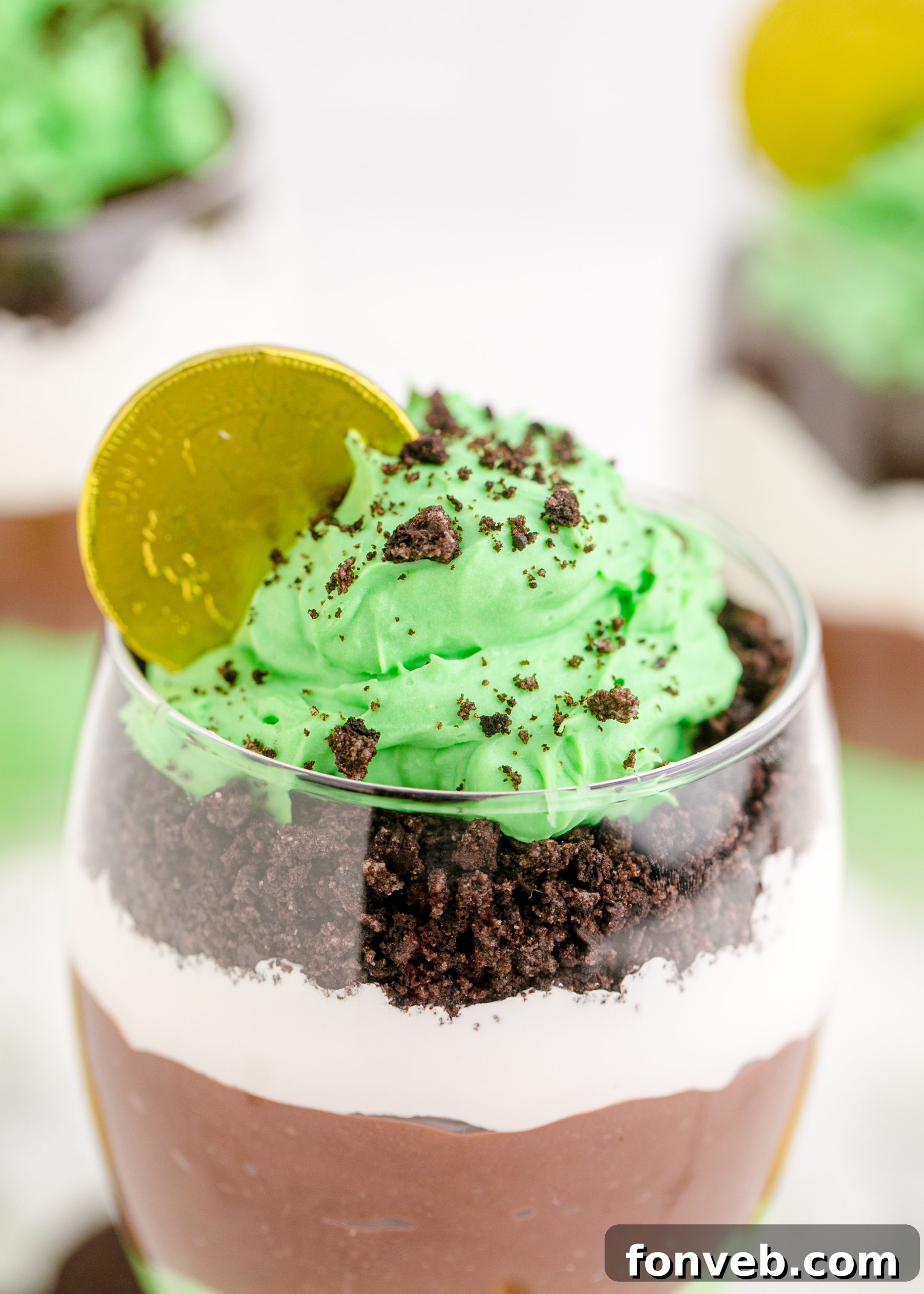 St. Patrick's Day Pudding Cups on a bright green backdrop