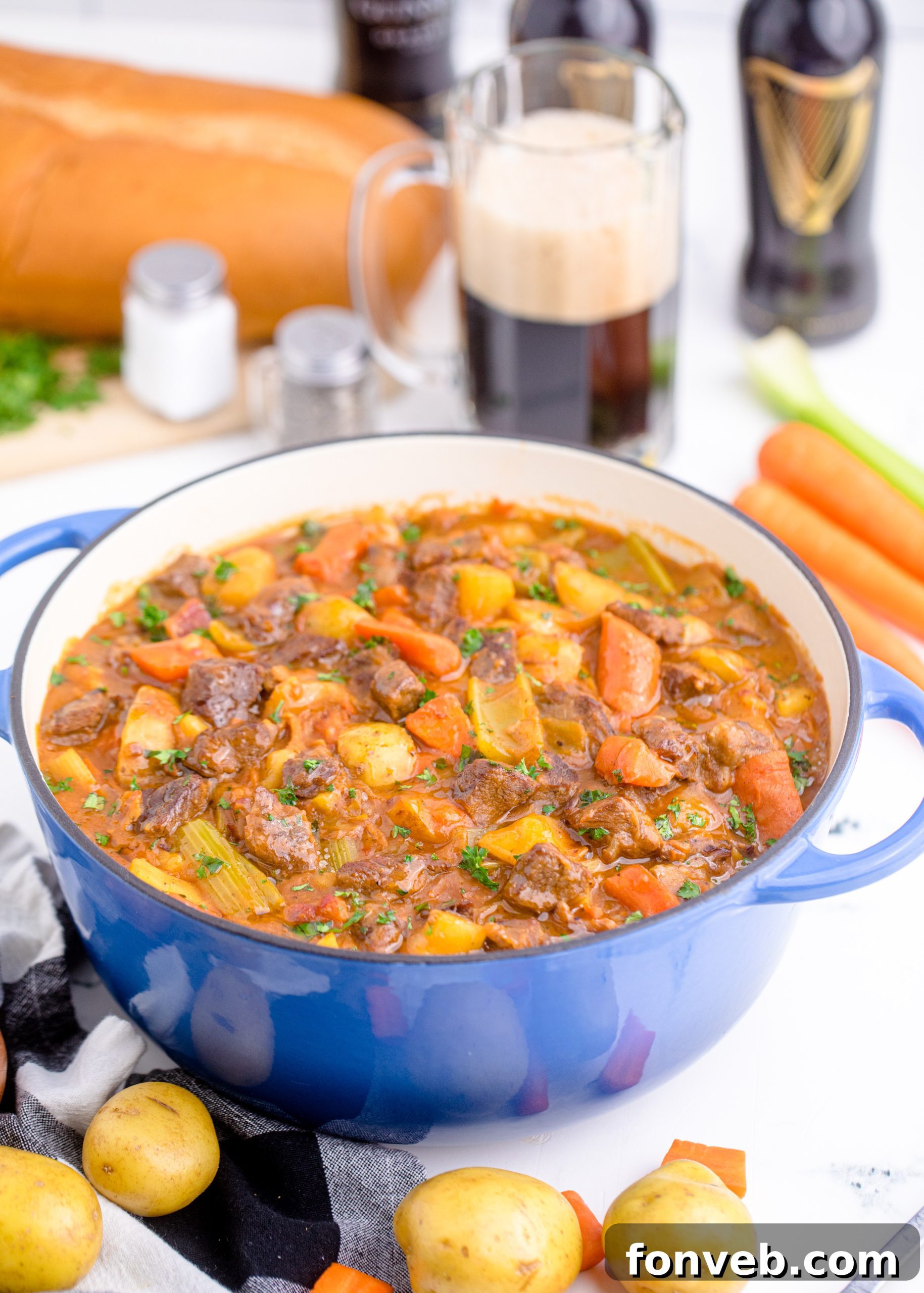 A bowl of Guinness Beef Stew with extra vegetables, garnished with parsley