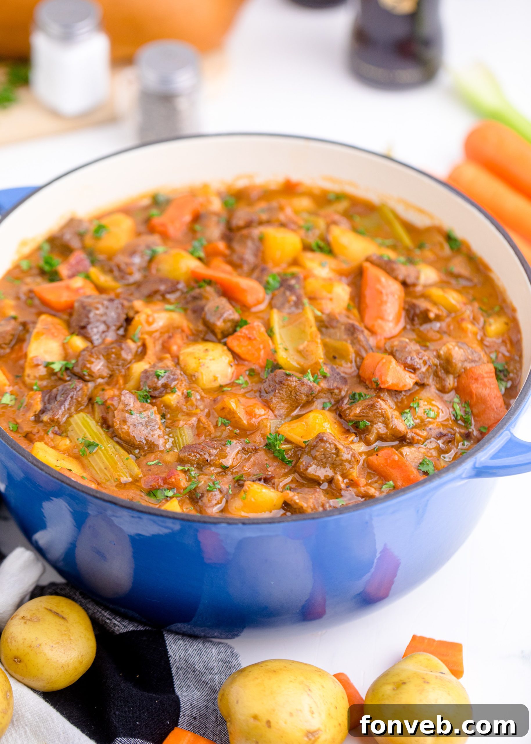 A cozy kitchen scene with a Dutch oven simmering on the stove