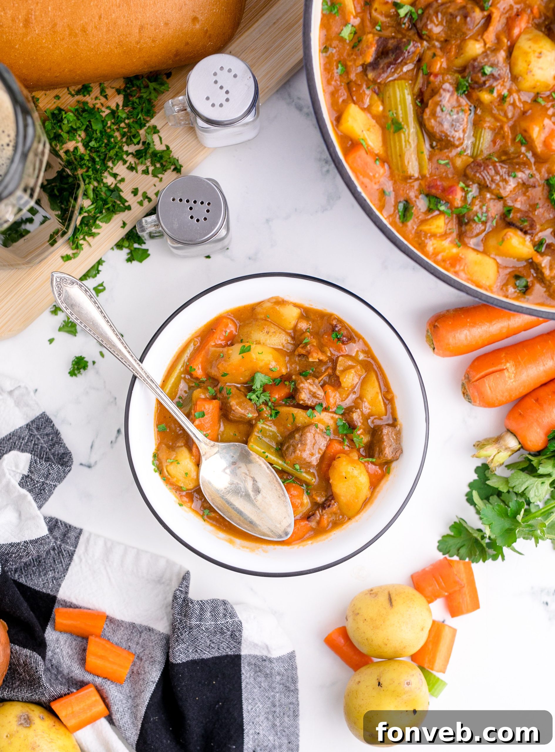 Ingredients for Guinness Beef Stew being prepared on a cutting board