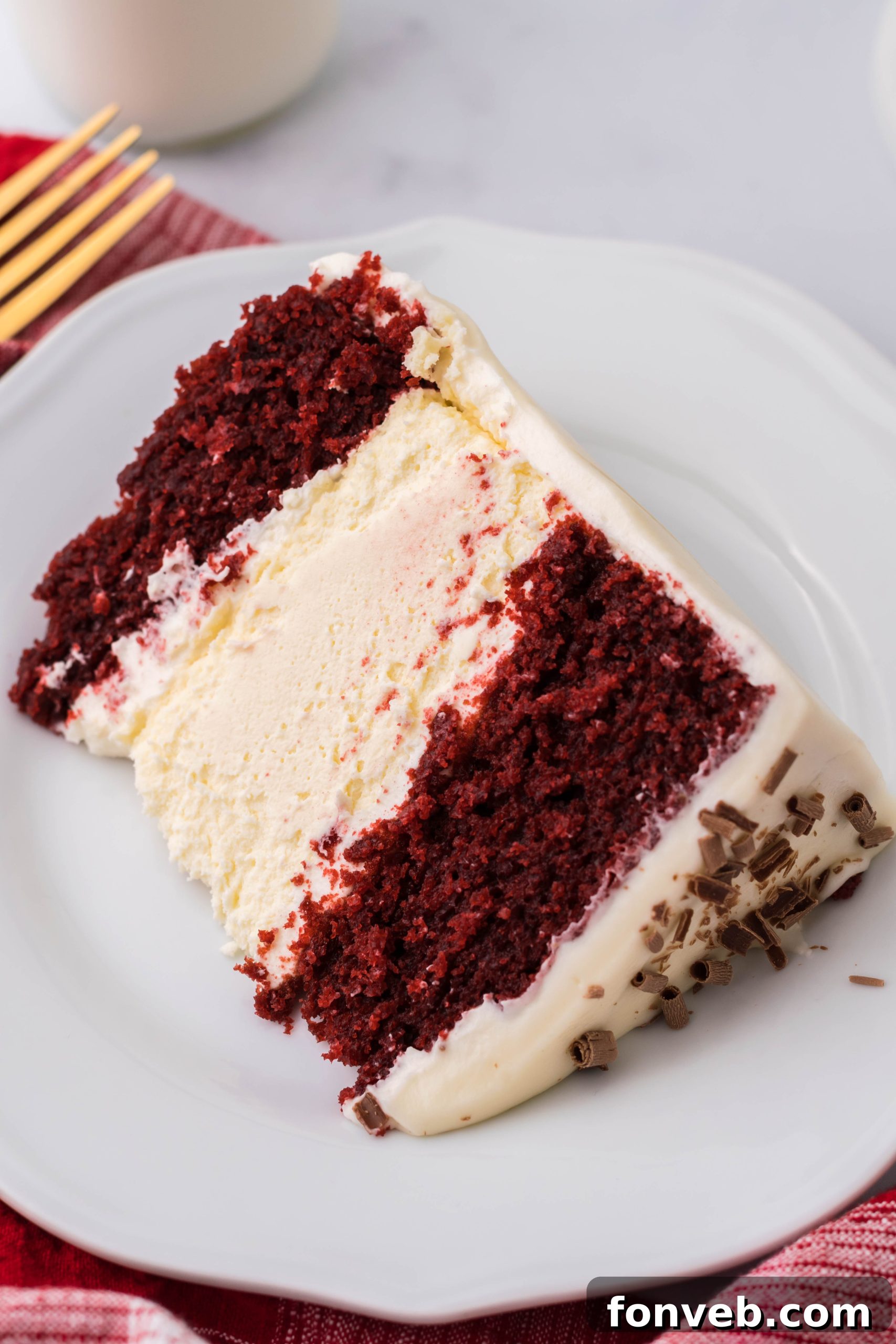 A bowl of cream cheese frosting, ready to be spread onto the cake.