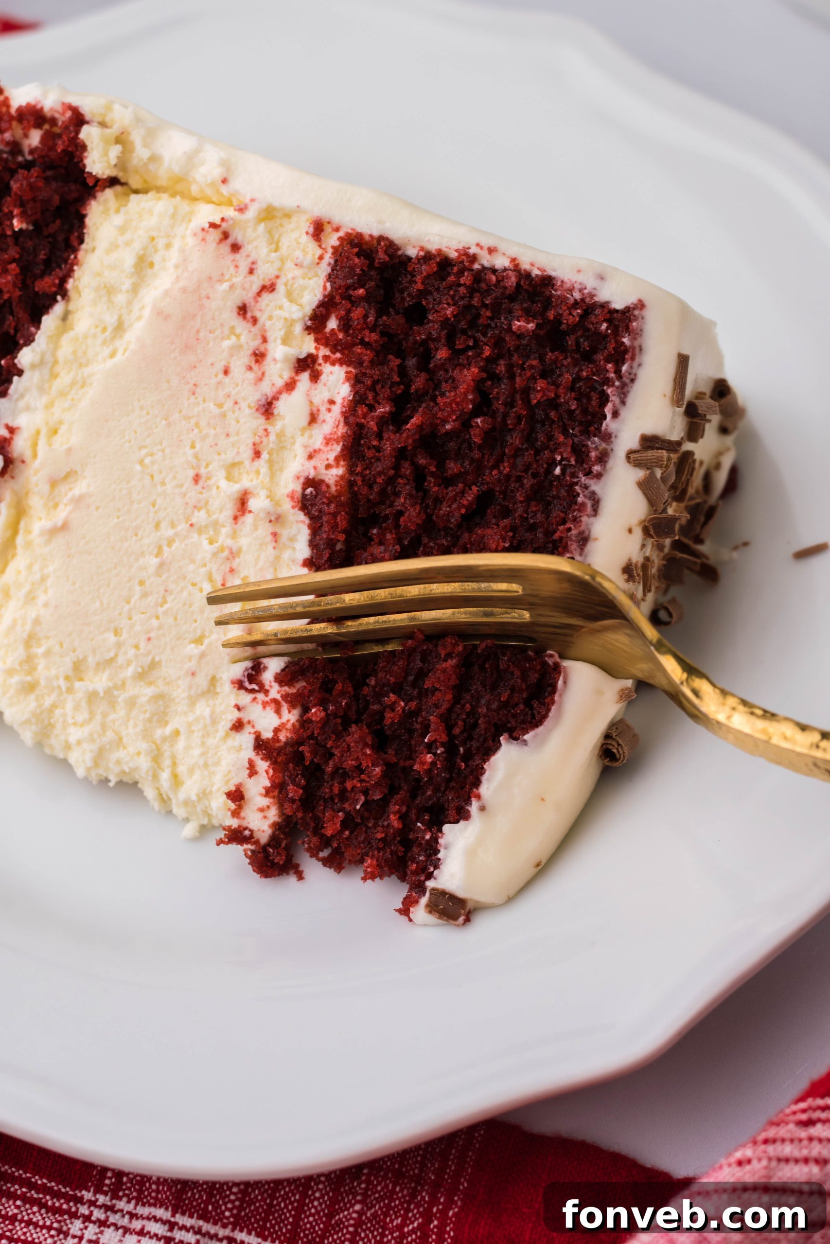 Ingredients for the Red Velvet Cheesecake Cake laid out on a table, including cream cheese, butter, and baking supplies.