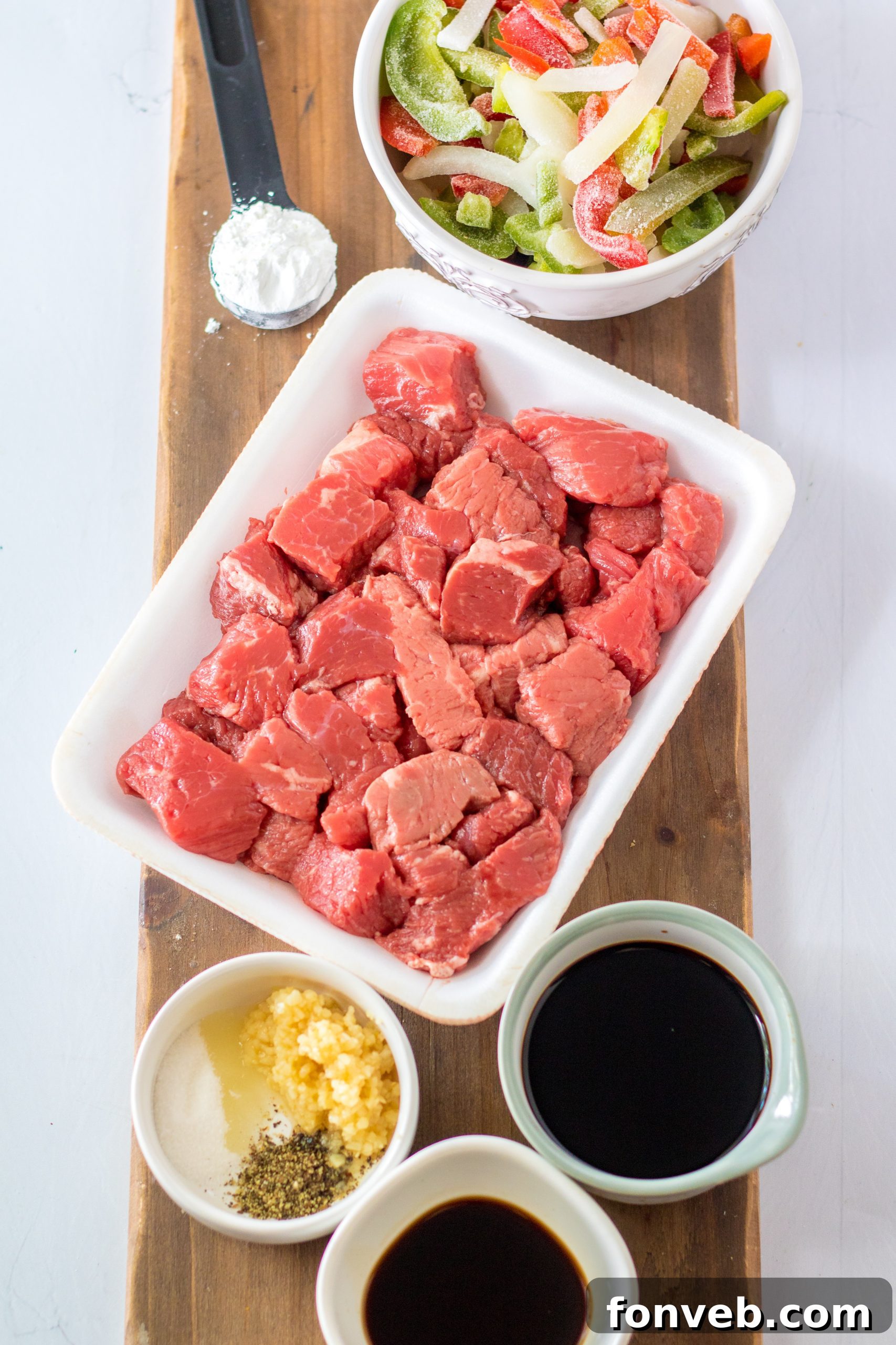 Hearty Slow Cooker Pepper Steak with Onions 3 Close-up of Slow Cooker Pepper Steak in a bowl with rice.