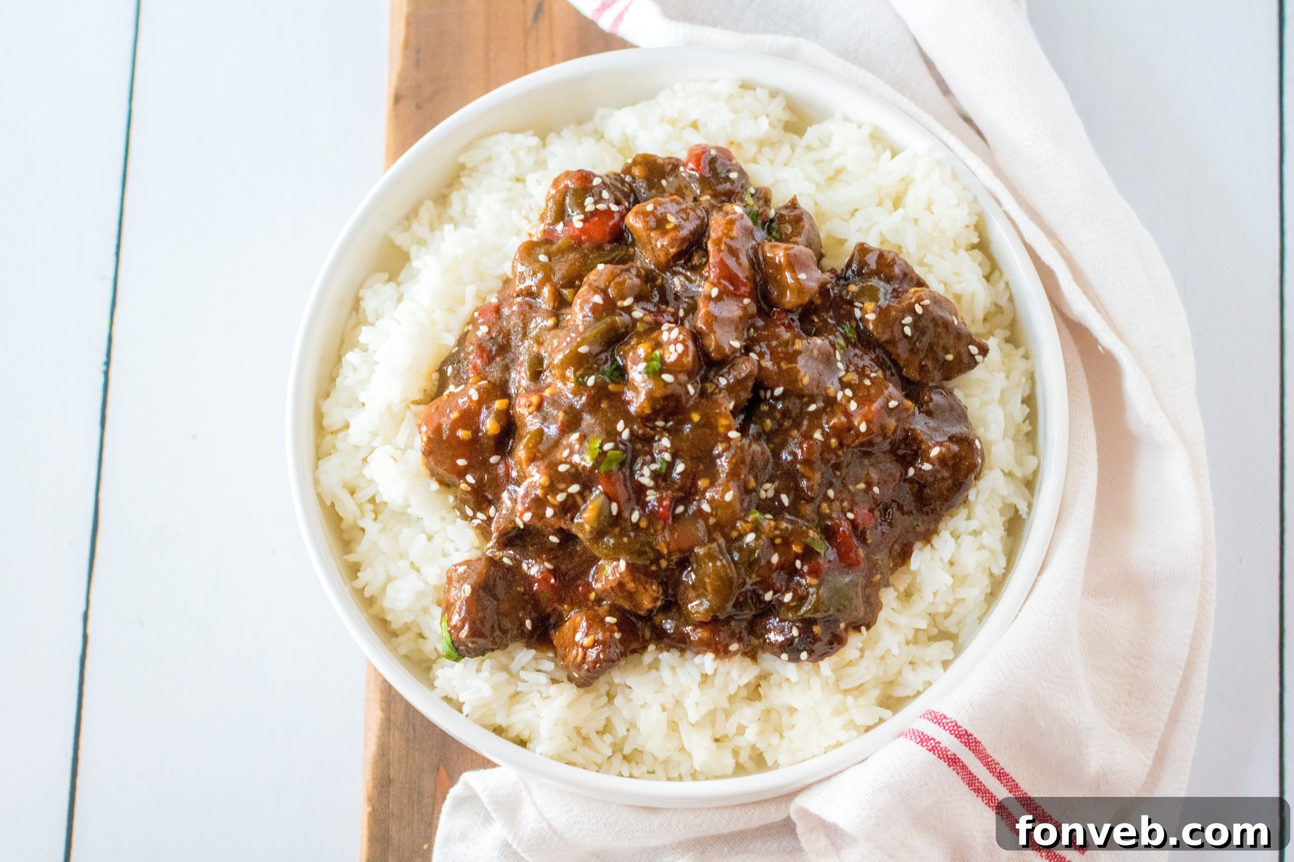 Hearty Slow Cooker Pepper Steak with Onions 9 Close-up of Slow Cooker Pepper Steak simmering.