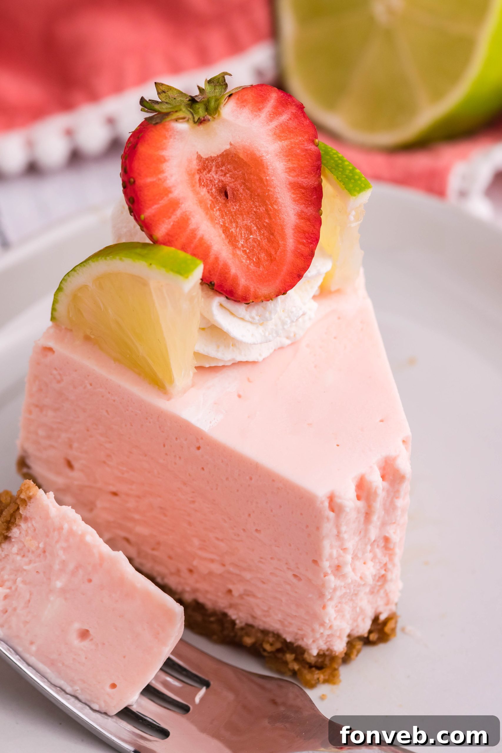 Two hands holding a slice of cheesecake, showing the crust and filling.