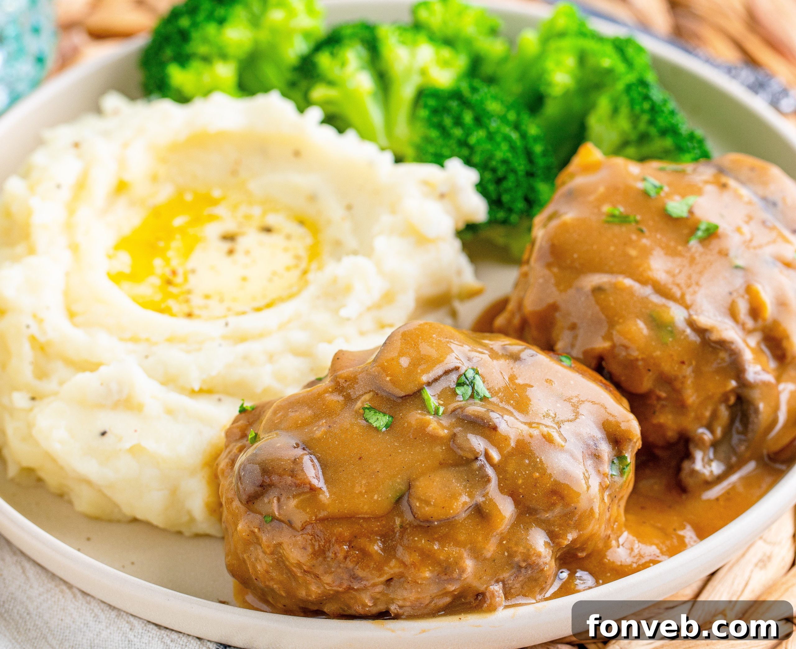 Hearty Salisbury Steaks with Rich Gravy 12 A full meal of Salisbury Steaks, mashed potatoes, and green beans, all drizzled with gravy.