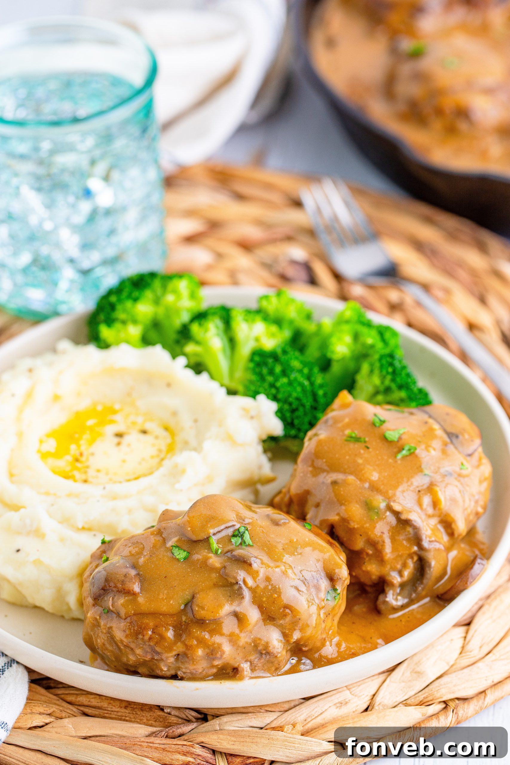 Hearty Salisbury Steaks with Rich Gravy 13 Two Salisbury Steaks on a plate, ready to be served, showcasing the rich gravy.