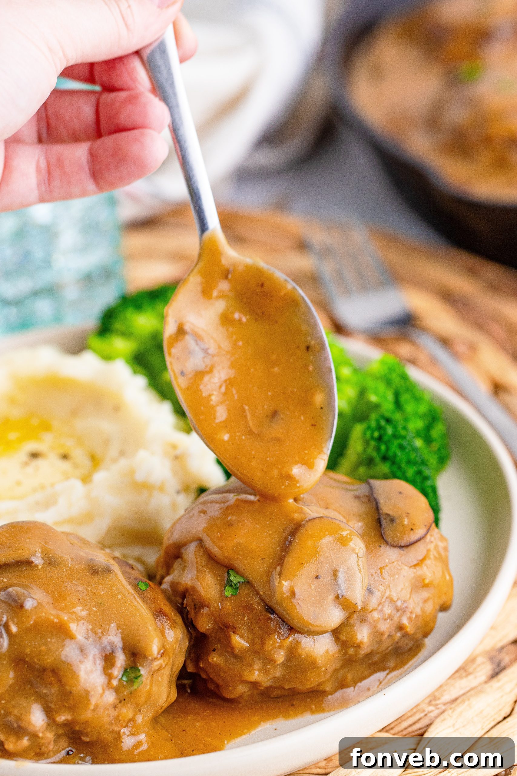 Hearty Salisbury Steaks with Rich Gravy 15 A close-up of the crushed beef bouillon cube, a key ingredient for flavor.