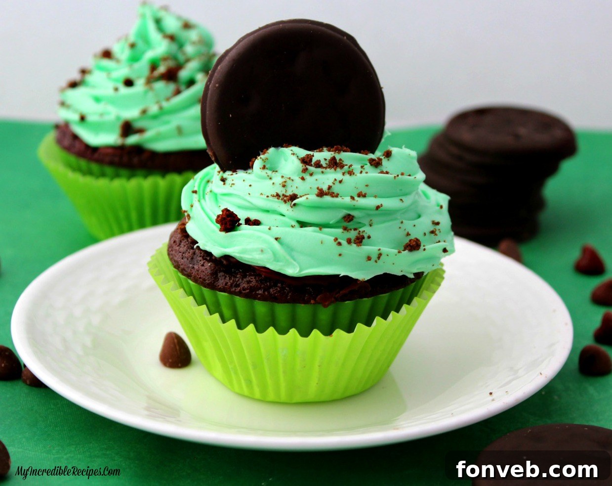 Delicious Thin Mint Cupcakes decorated with frosting and a Thin Mint cookie on top.