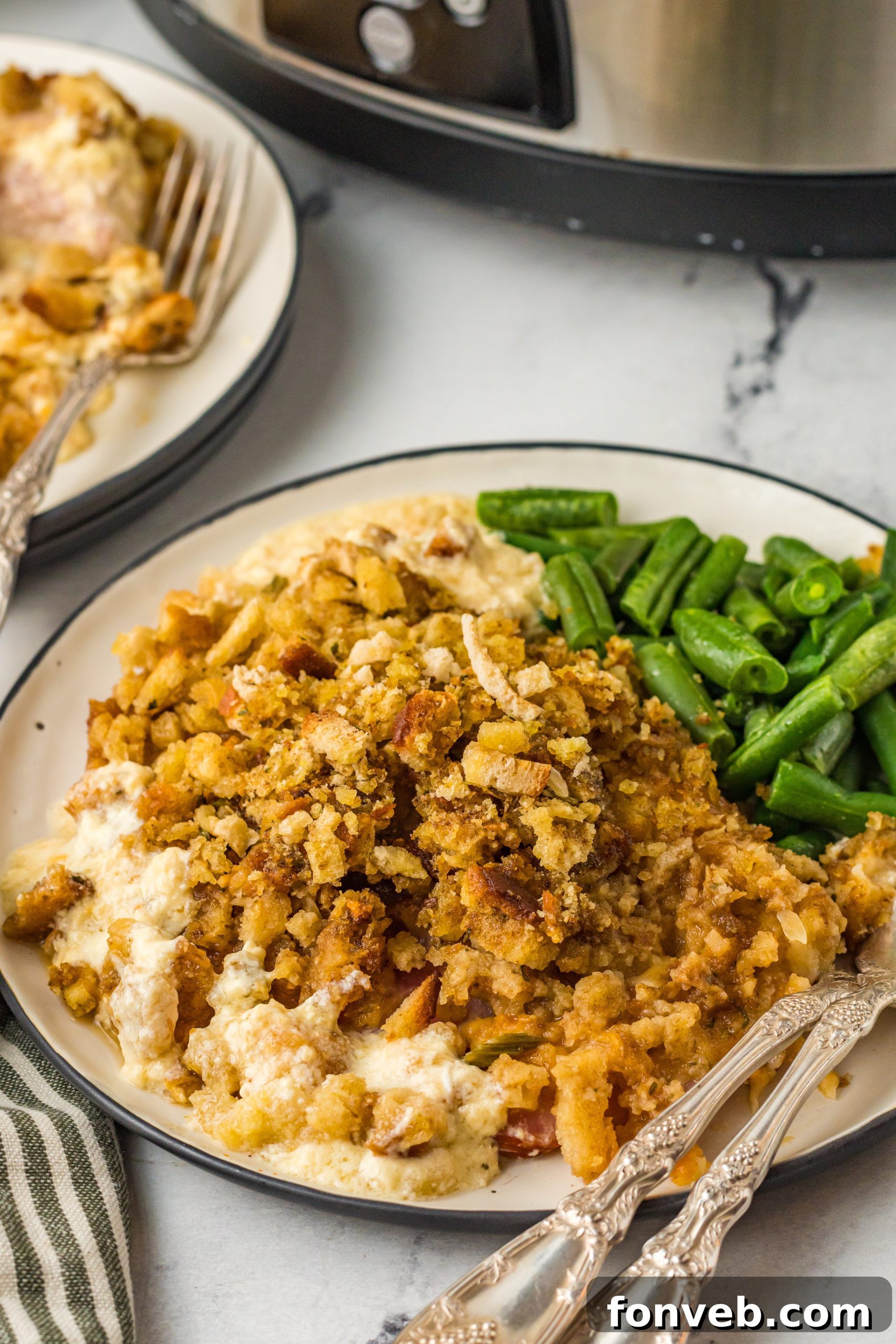 One-Pot Slow Cooker Chicken Cordon Bleu and Stuffing Dinner 2 Slow Cooker Chicken Cordon Bleu in a crockpot, layered with chicken, ham, cheese, and stuffing.