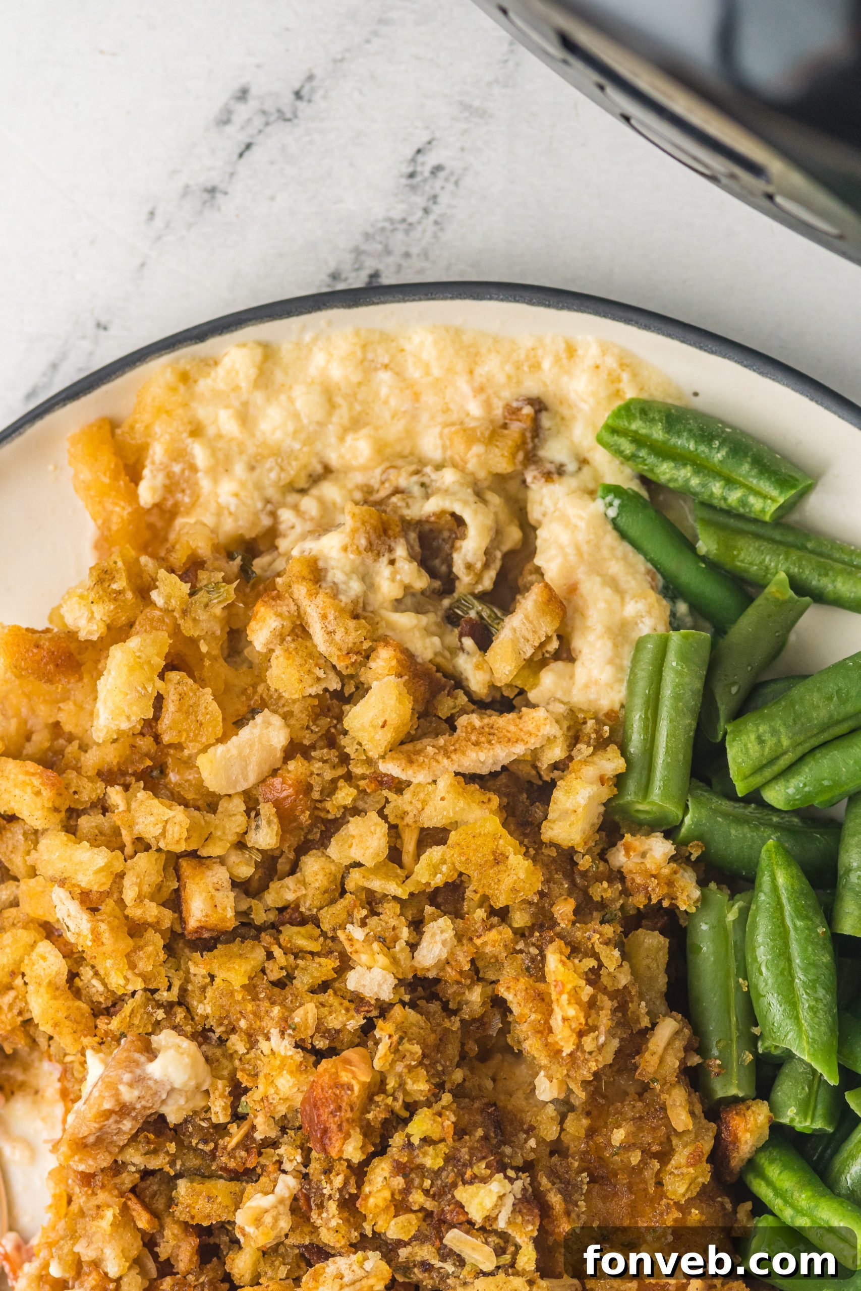 One-Pot Slow Cooker Chicken Cordon Bleu and Stuffing Dinner 7 Chicken cordon bleu cooking in a slow cooker, showing the layers of ingredients.