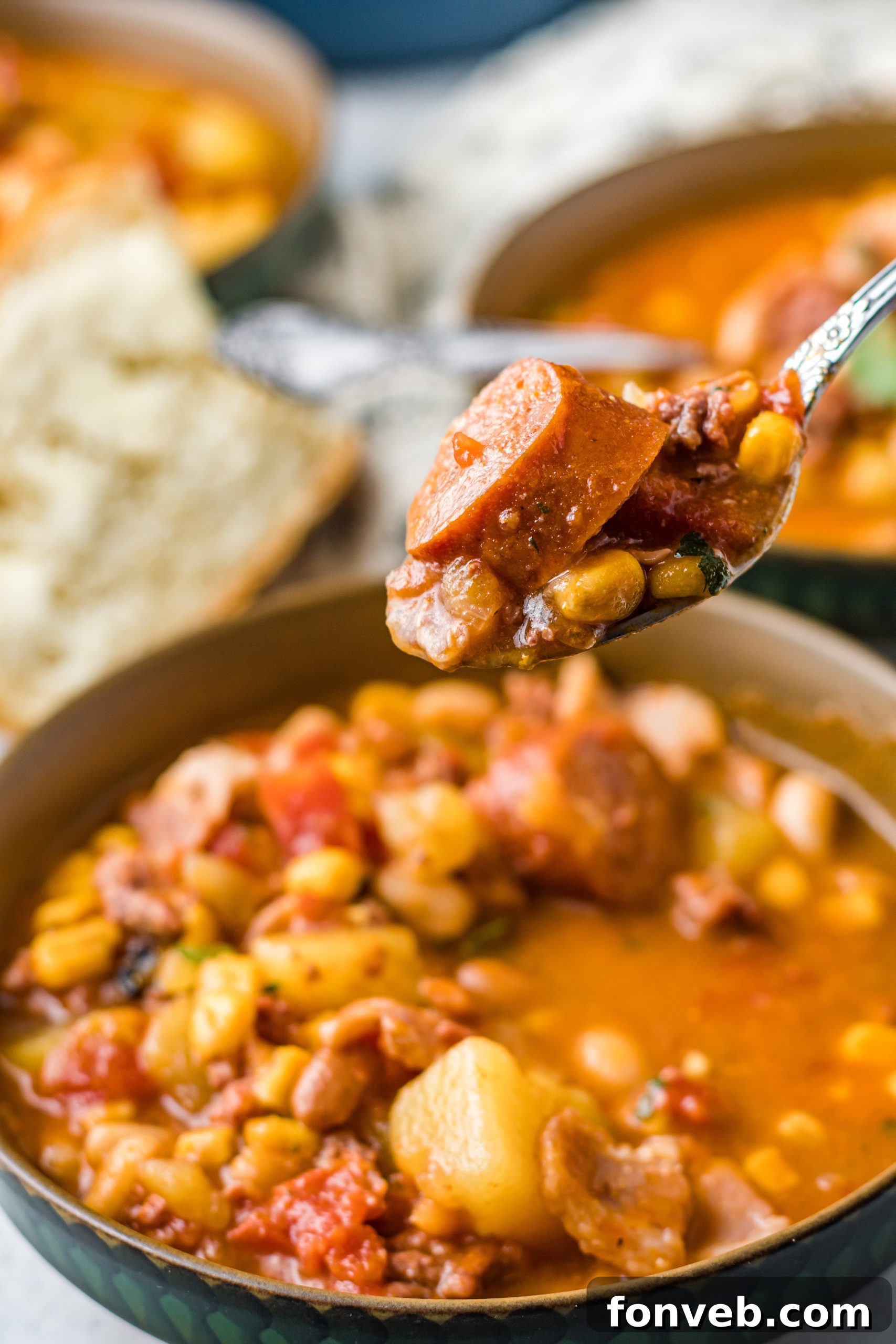 Wrangler's Hearty Stew 16 A rustic dining table setting with multiple bowls of Cowboy Stew and cornbread.