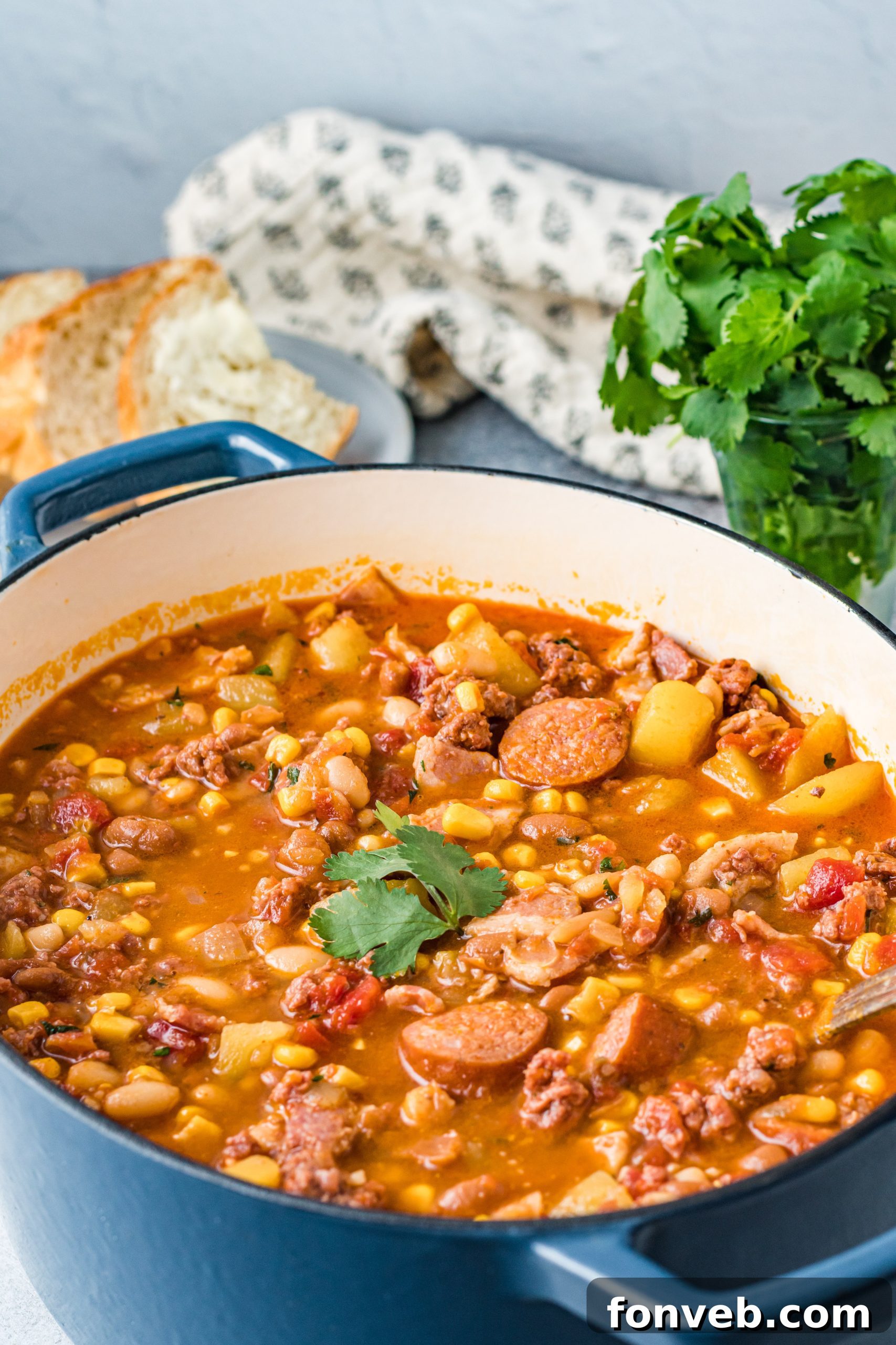 Wrangler's Hearty Stew 17 A cozy kitchen scene featuring a pot of Cowboy Stew simmering on the stovetop, emanating warmth.