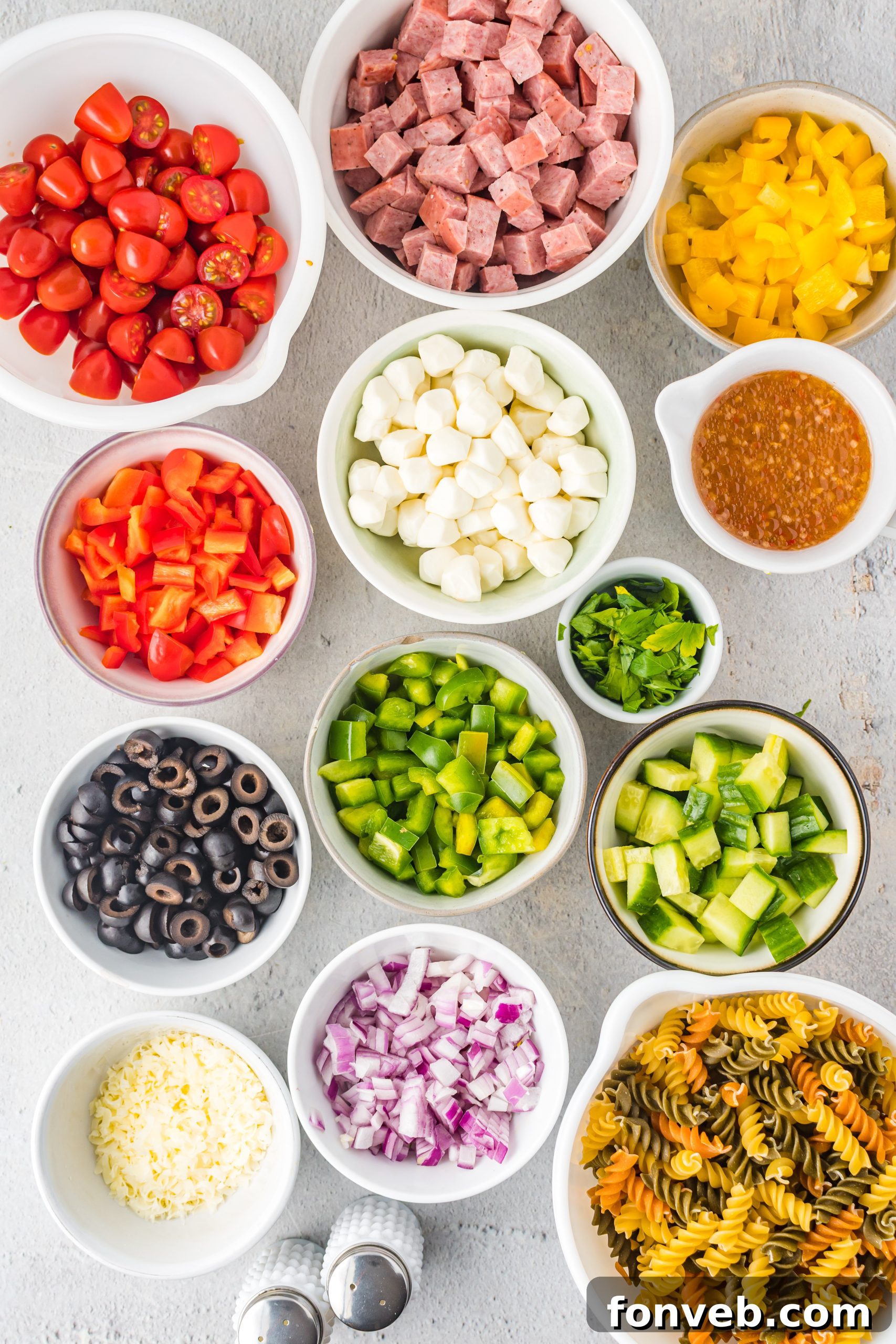 Another overhead shot of the Italian Pasta Salad, showing a generous portion ready to be served, emphasizing the fresh ingredients and the vibrant dressing.