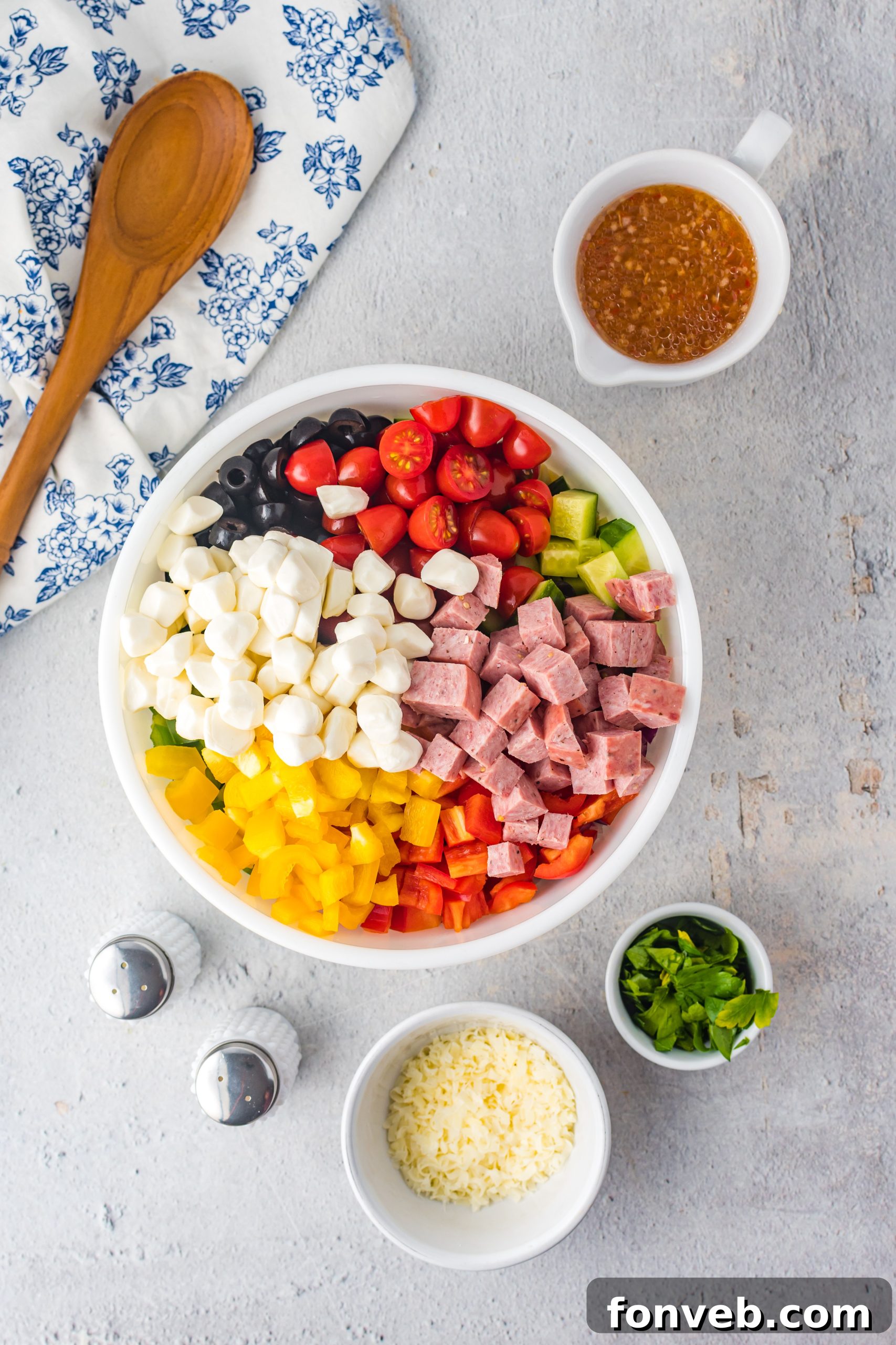 A slightly different angle of the pasta salad, showcasing the texture of the rotini pasta and the chopped ingredients, promising a satisfying culinary experience.