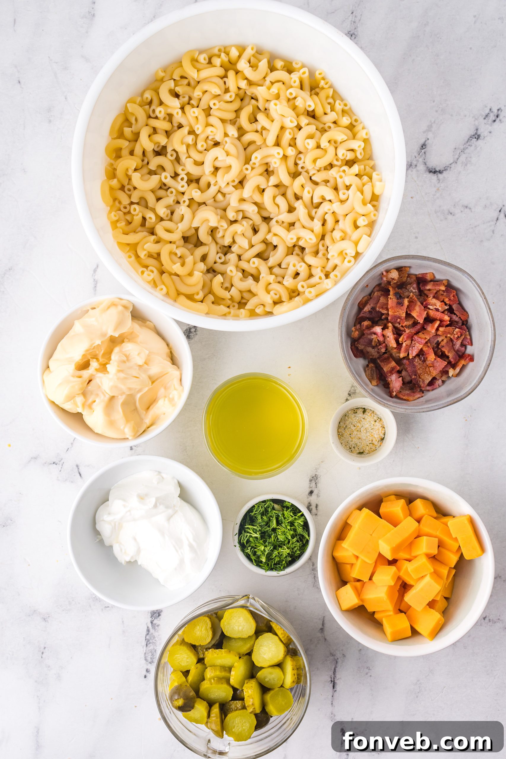 A large serving bowl filled with creamy Dill Pickle Pasta Salad, ready to be enjoyed as a refreshing side.