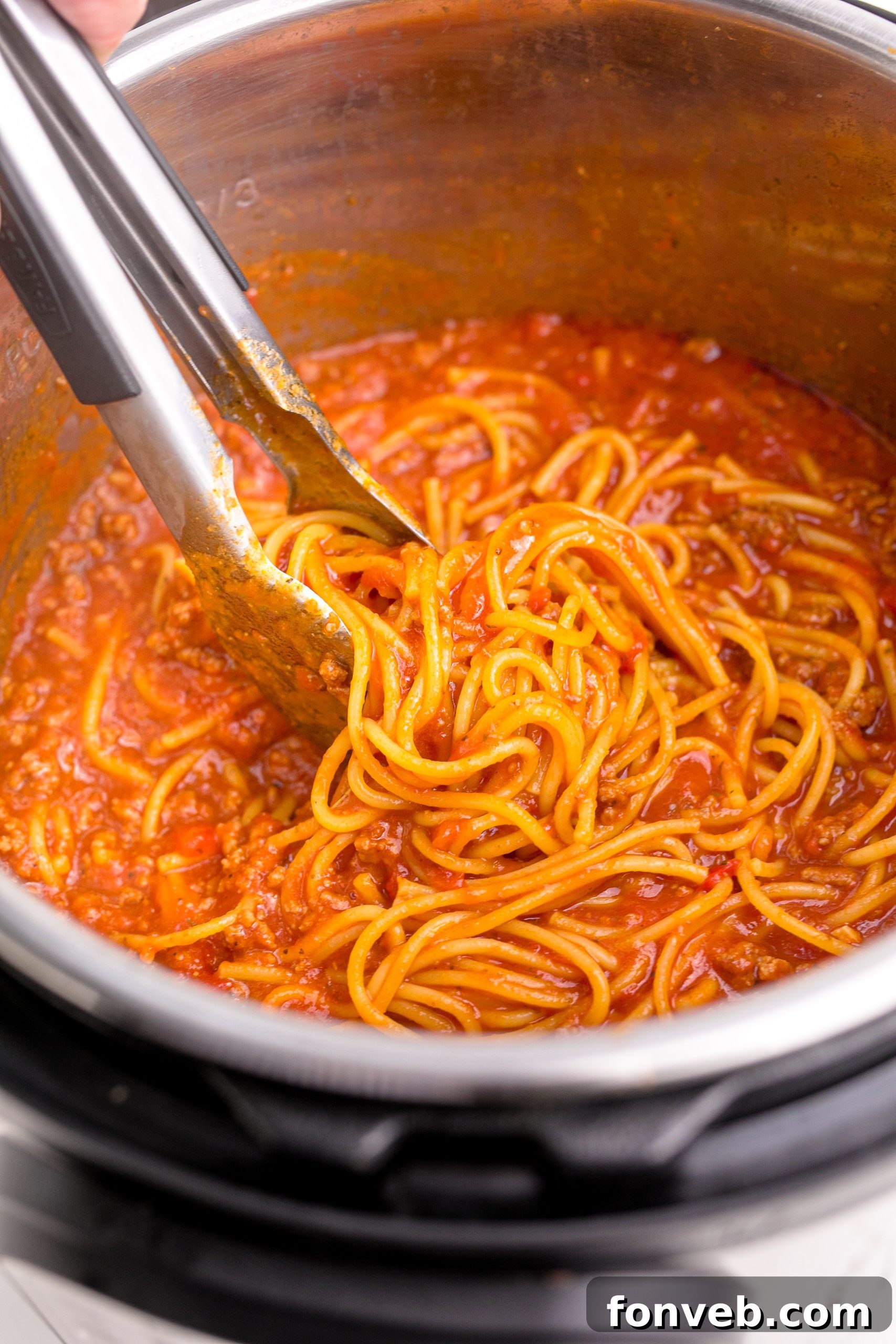 Instant Pot Spaghetti inside the instant pot cooking