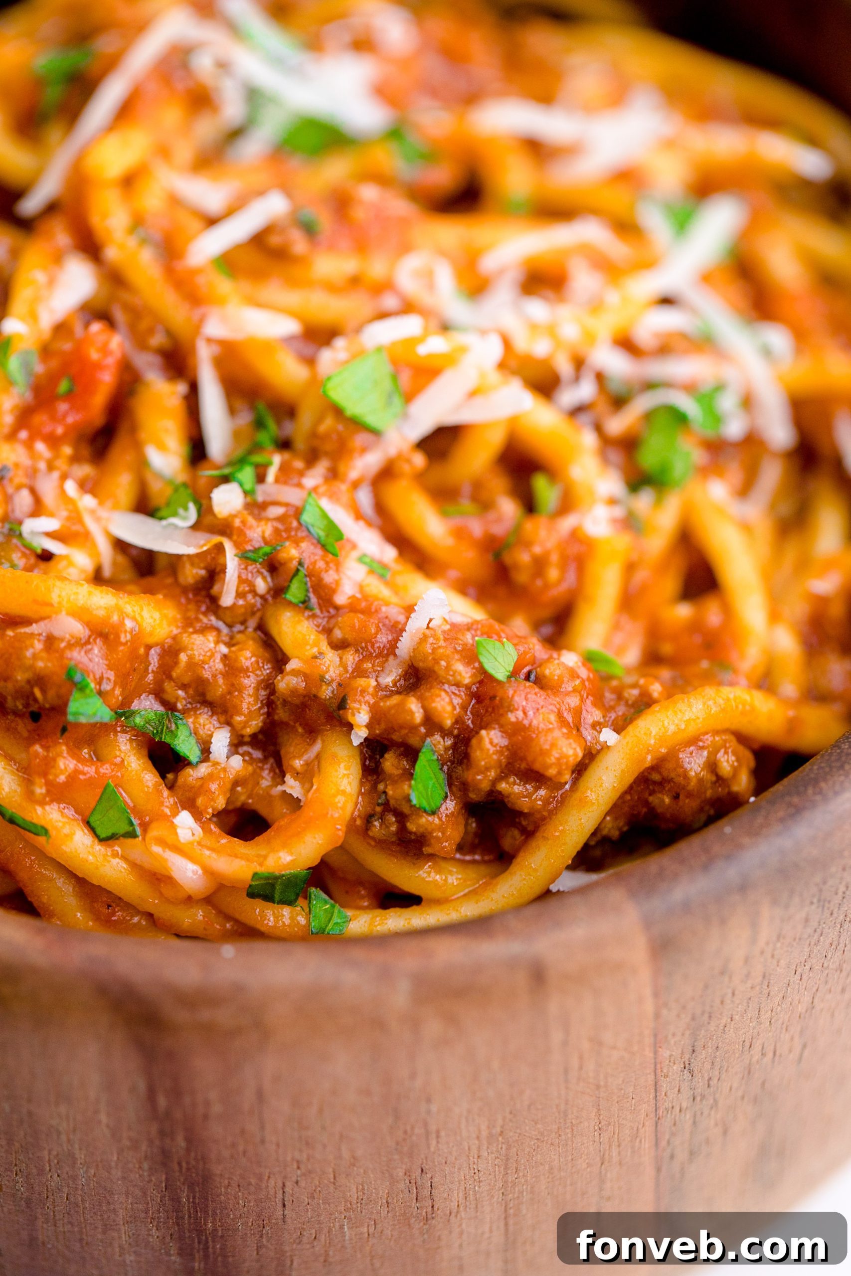 Instant Pot Spaghetti in a wooden bowl close up to see texture