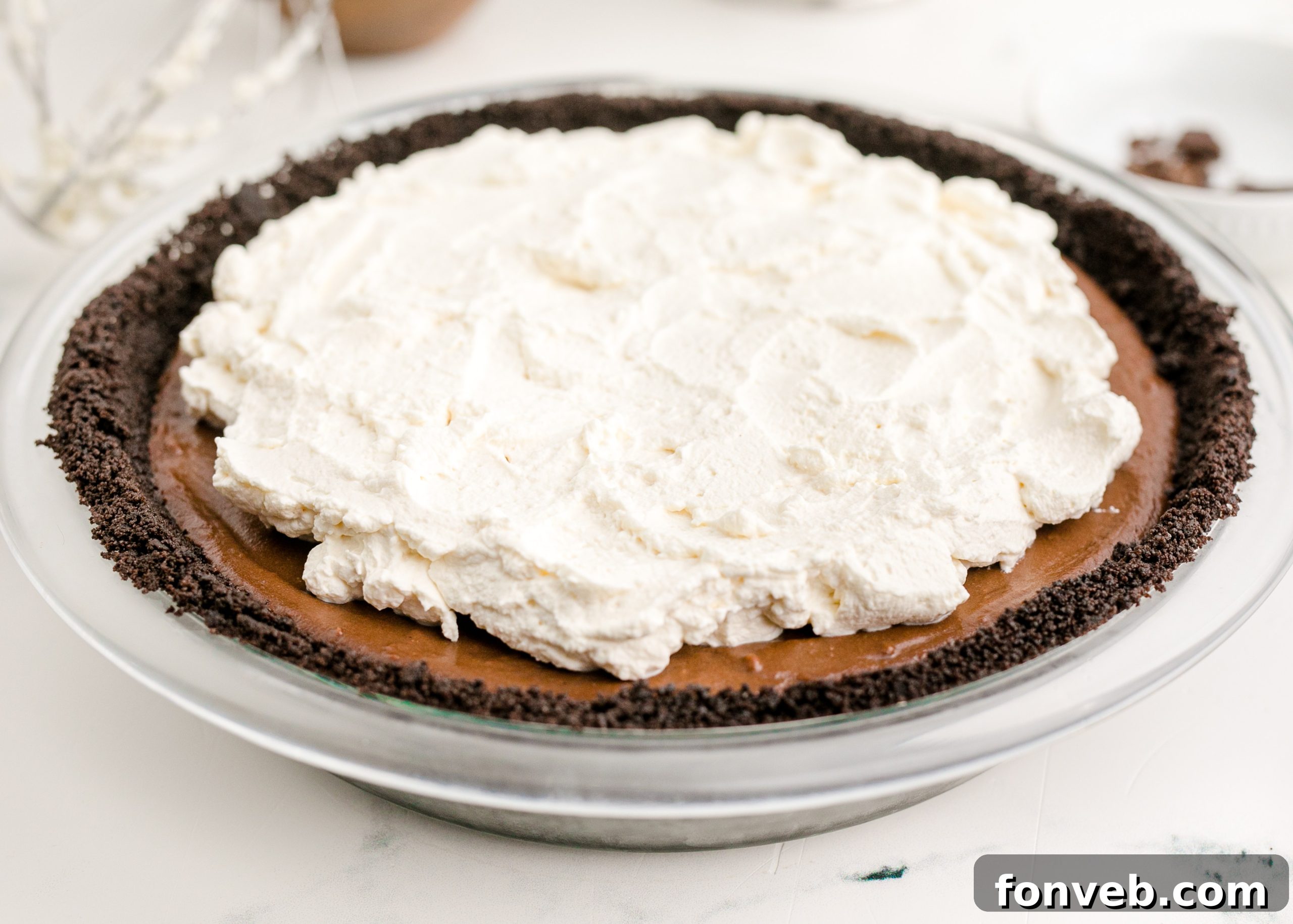 Velvet Chocolate Dream 8 Chocolate Cream Pie topped with real whipped cream and garnished with chocolate shavings