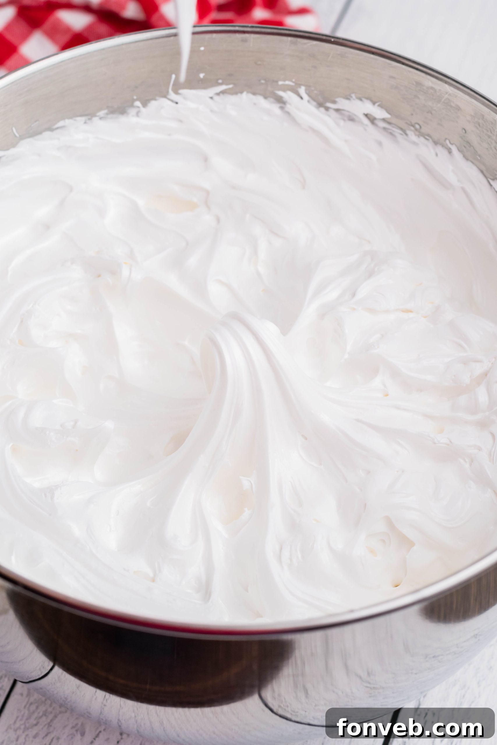 Bowl of fluffy homemade marshmallow frosting