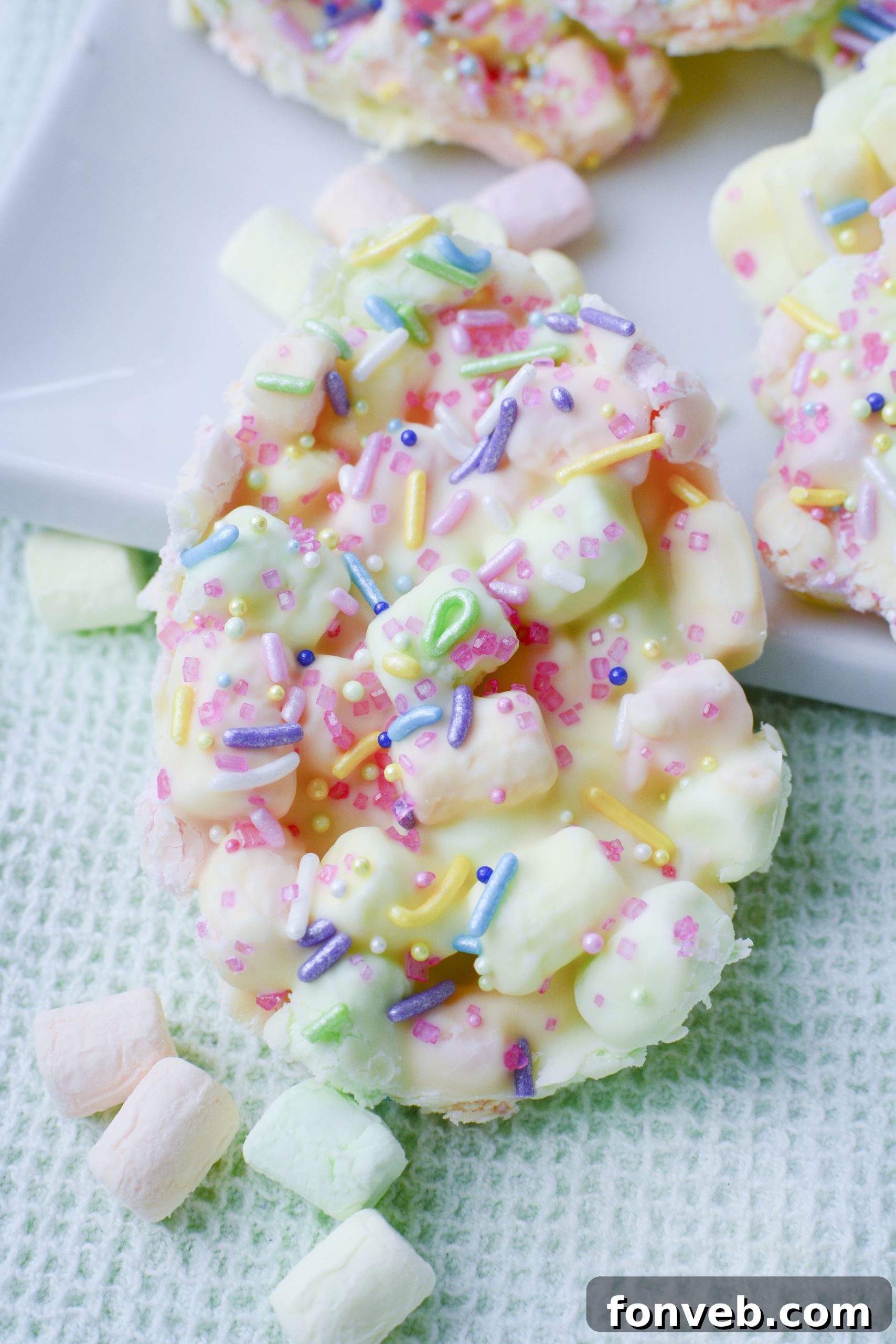 Easter Marshmallow treats with pink, green and yellow mini marshmallows cut into the shape of eggs