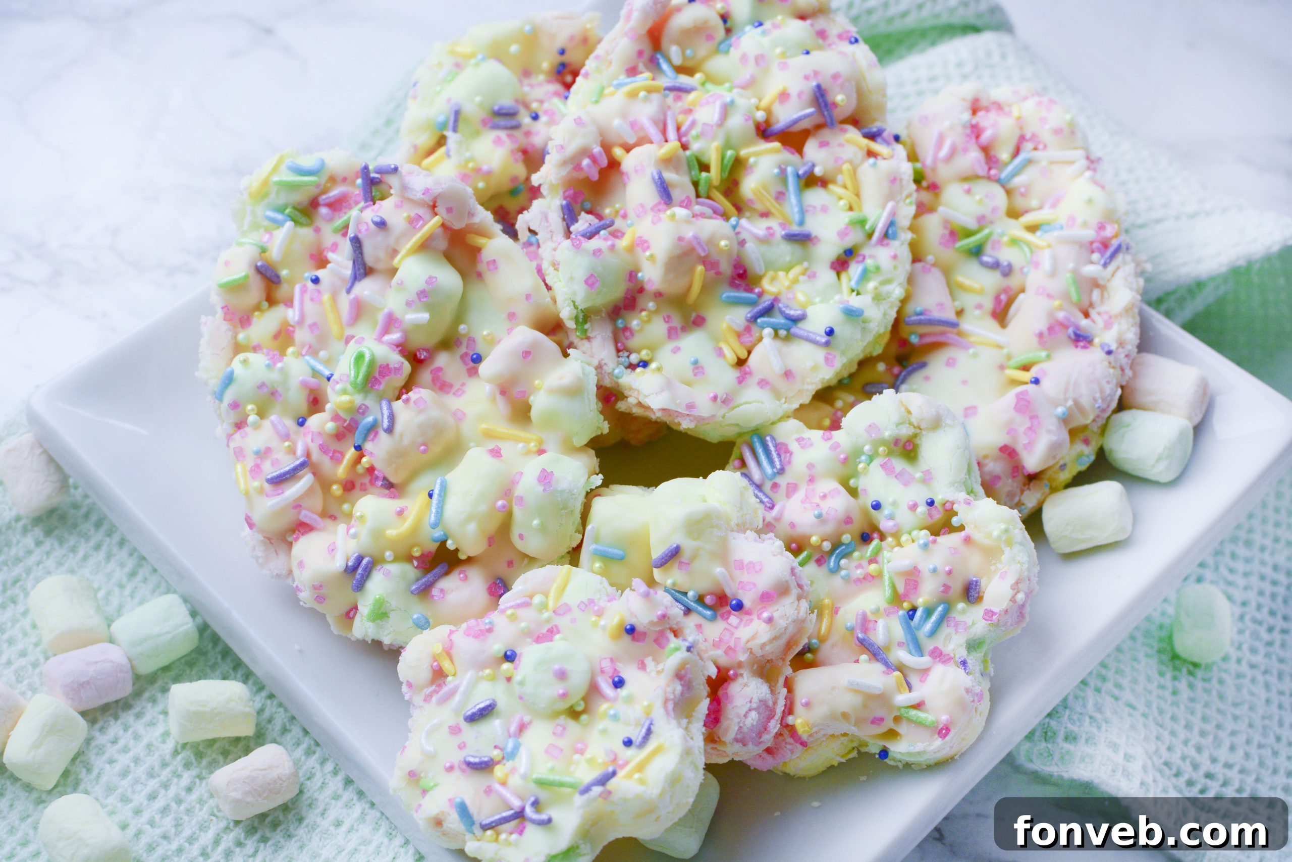 Easter Marshmallow treats with pink, green and yellow mini marshmallows cut into the shape of eggs